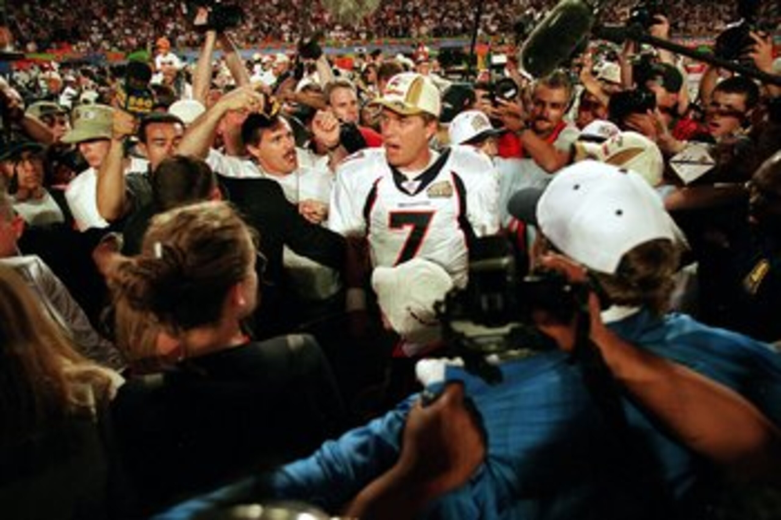 31 Jan 1999: John Elway #7 of the Denver Broncos talks to reporters after the Superbowl XXXIII against the Atlanta Falcons at the Pro Player Stadium in Miami, Florida. The Broncos defeated the Falcons 34-19. Mandatory Credit: Rick Stewart /Allsport 31 Jan 1999: John Elway #7 of the Denver Broncos talks to reporters after the Superbowl XXXIII against the Atlanta Falcons at the Pro Player Stadium in Miami, Florida. The Broncos defeated the Falcons 34-19. Mandatory Credit: Rick Stewart /Allsport