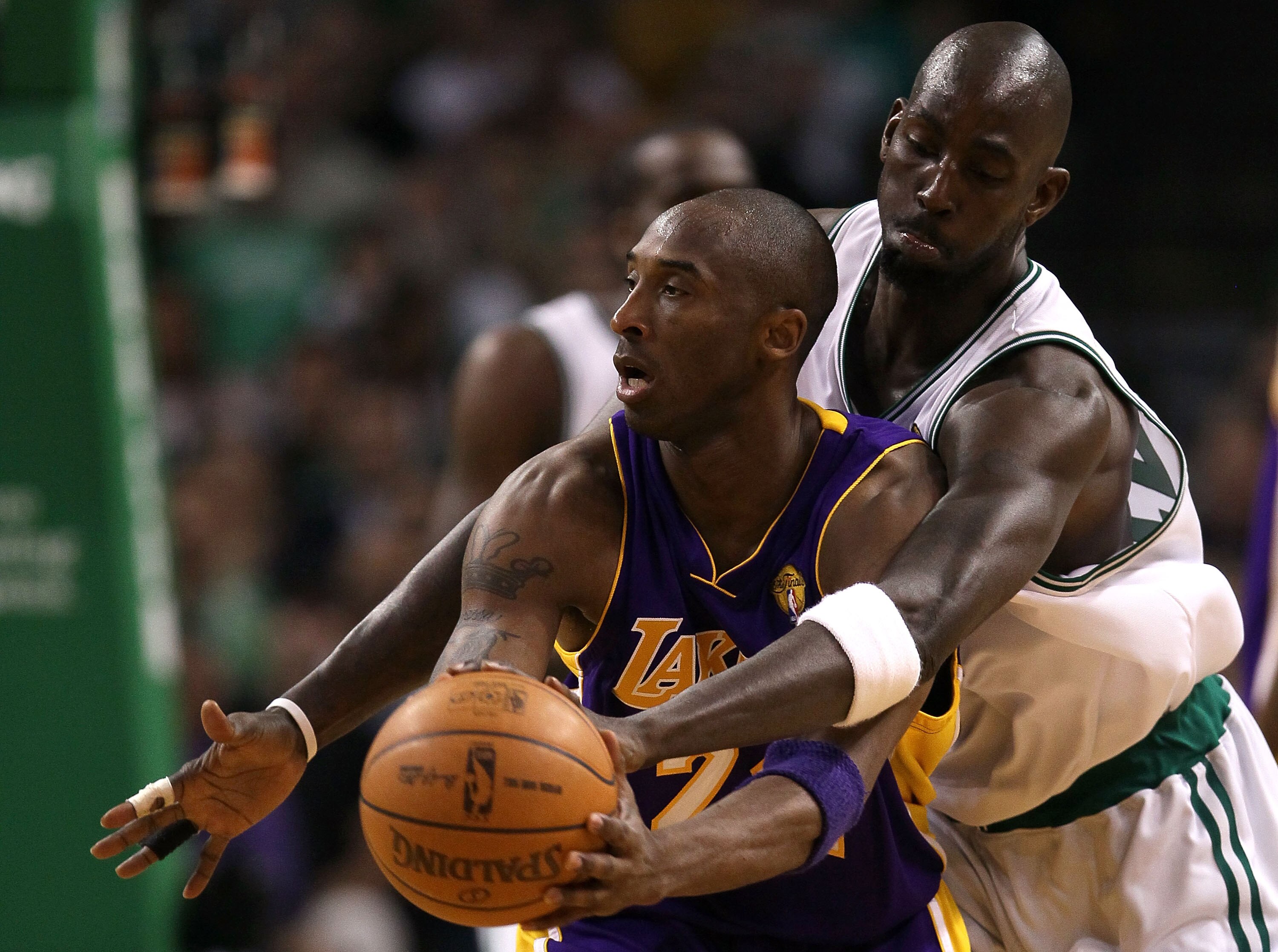 BOSTON - JUNE 08:  Kevin Garnett #5 of the Boston Celtics attempts to steal the ball from Kobe Bryant #24 of the Los Angeles Lakers in Game Three of the 2010 NBA Finals on June 8, 2010 at TD Garden in Boston, Massachusetts. NOTE TO USER: User expressly ac