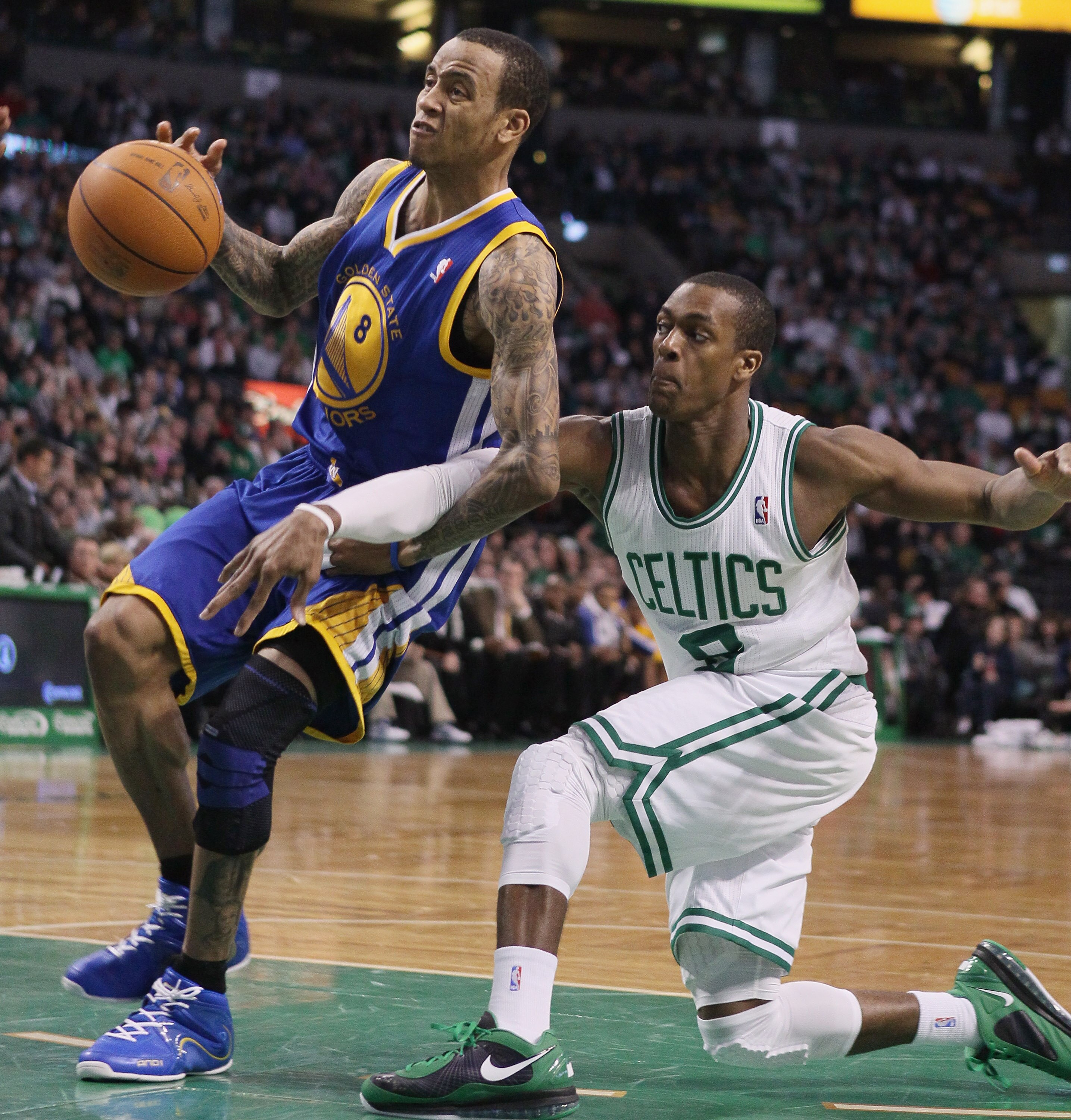 BOSTON, MA - MARCH 04:  Rajon Rondo #9 of the Boston Celtics tries to steal the ball from Monta Ellis #8 of the Golden State Warriors on March 4, 2011 at the TD Garden in Boston, Massachusetts.  The Celtics defeated the Warriors 107-103. NOTE TO USER: Use