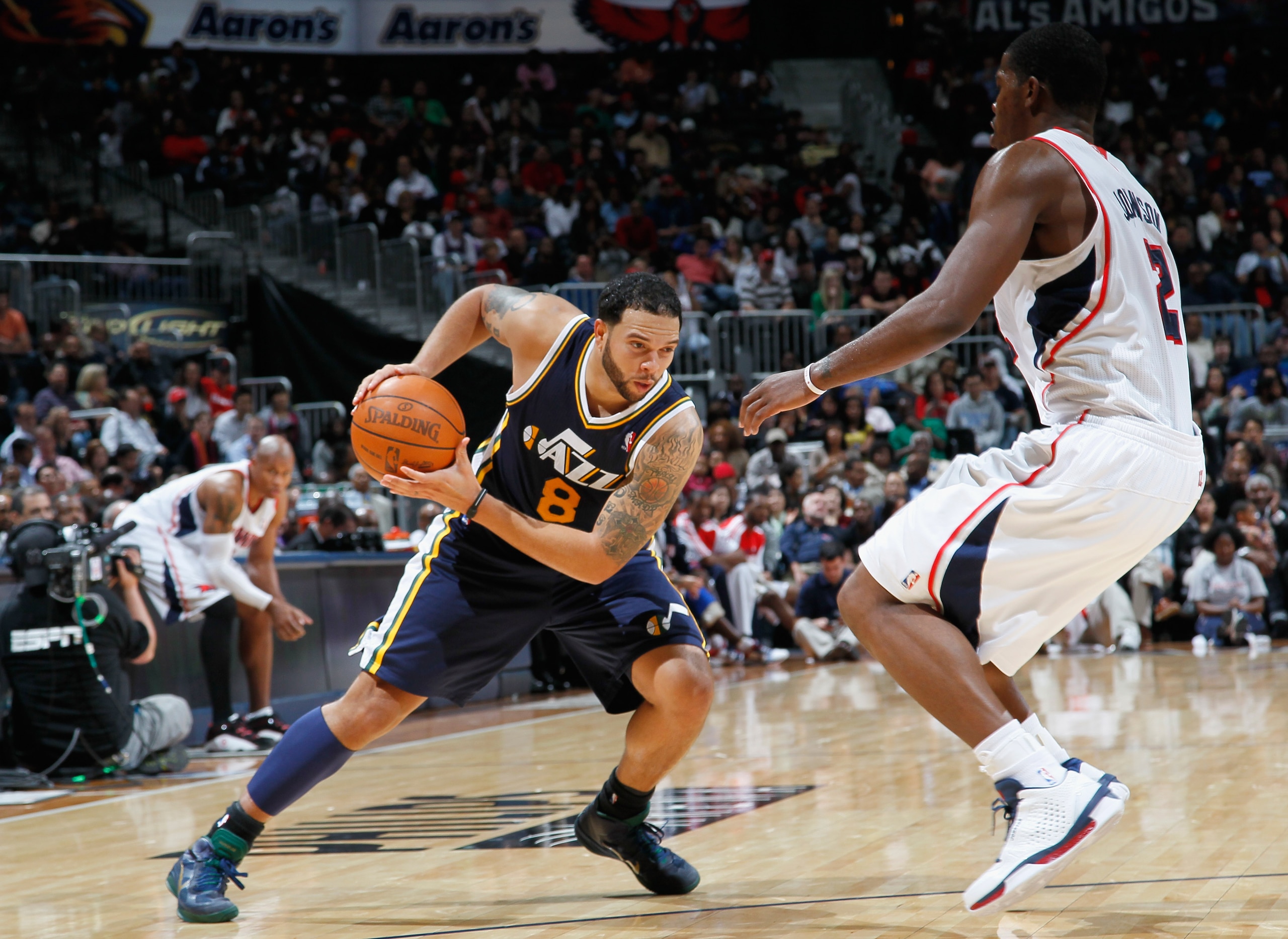 ATLANTA - NOVEMBER 12: Deron Williams #8 of the Utah Jazz drives against Joe Johnson #2 of the Atlanta Hawks at Philips Arena on November 12, 2010 in Atlanta, Georgia. NOTE TO USER: User expressly acknowledges and agrees that, by downloading and/or usin ATLANTA - NOVEMBER 12: Deron Williams #8 of the Utah Jazz drives against Joe Johnson #2 of the Atlanta Hawks at Philips Arena on November 12, 2010 in Atlanta, Georgia. NOTE TO USER: User expressly acknowledges and agrees that, by downloading and/or usin