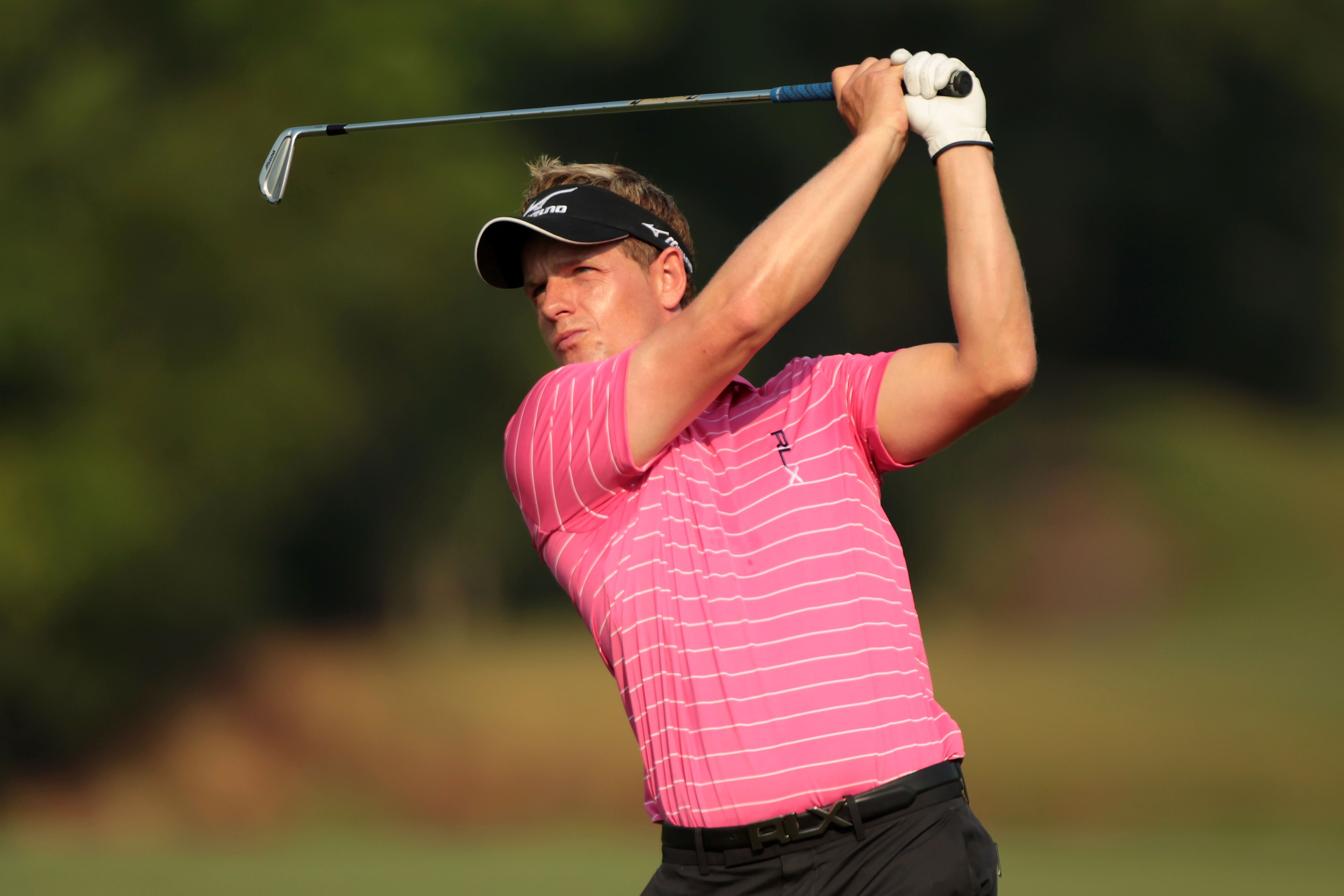 PONTE VEDRA BEACH, FL - MAY 10:  Luke Donald of England hits a shot during a practice round prior to the start of THE PLAYERS Championship held at THE PLAYERS Stadium course at TPC Sawgrass on May 10, 2011 in Ponte Vedra Beach, Florida.  (Photo by Scott H