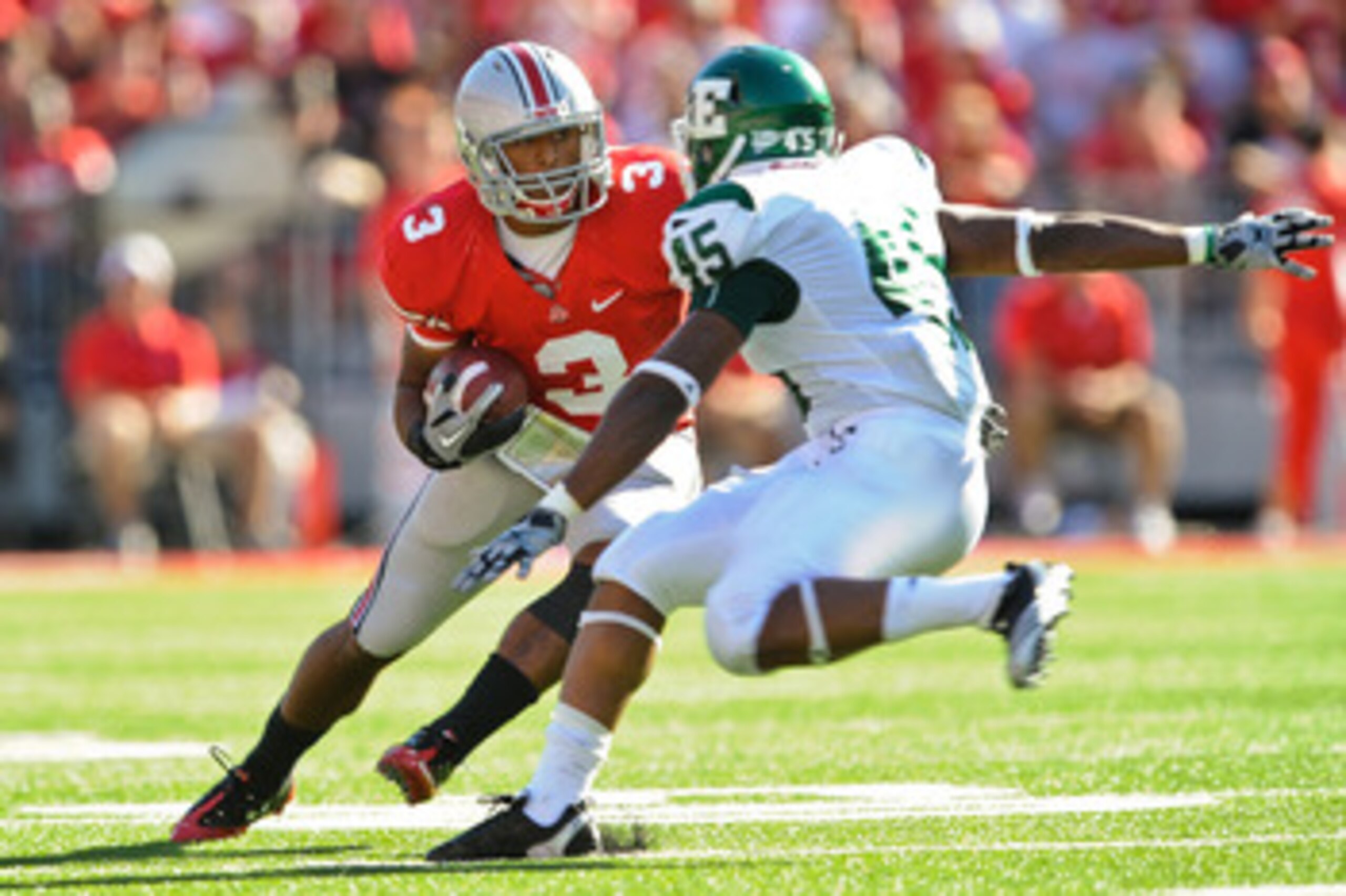COLUMBUS, OH - SEPTEMBER 25:  Brandon Saine #3 of the Ohio State Buckeyes runs with the ball against Matt Boyd #45 of the Eastern Michigan Eagles at Ohio Stadium on September 25, 2010 in Columbus, Ohio.  Ohio State won 73-20. (Photo by Jamie Sabau/Getty I