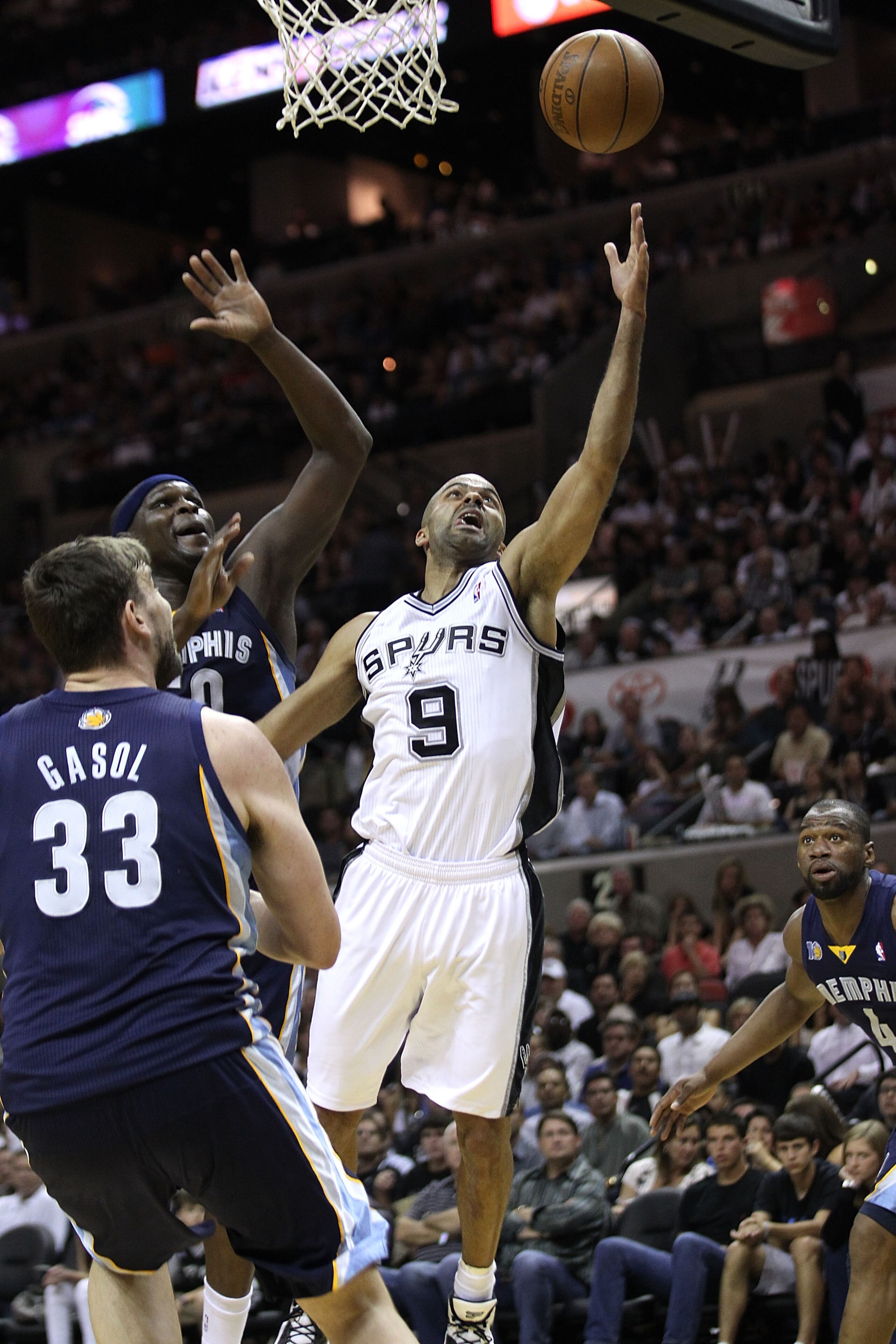 SAN ANTONIO, TX - APRIL 27: Tony Parker #9 of the San Antionio Spurs shoots over Marc Gasol #33 and Zach Randolph #50 of the Memphis Grizzlies in Game Five of the Western Conference Quarterfinals in the 2011 NBA Playoffs on April 27, 2011 at AT&T Center SAN ANTONIO, TX - APRIL 27: Tony Parker #9 of the San Antionio Spurs shoots over Marc Gasol #33 and Zach Randolph #50 of the Memphis Grizzlies in Game Five of the Western Conference Quarterfinals in the 2011 NBA Playoffs on April 27, 2011 at AT&T Center