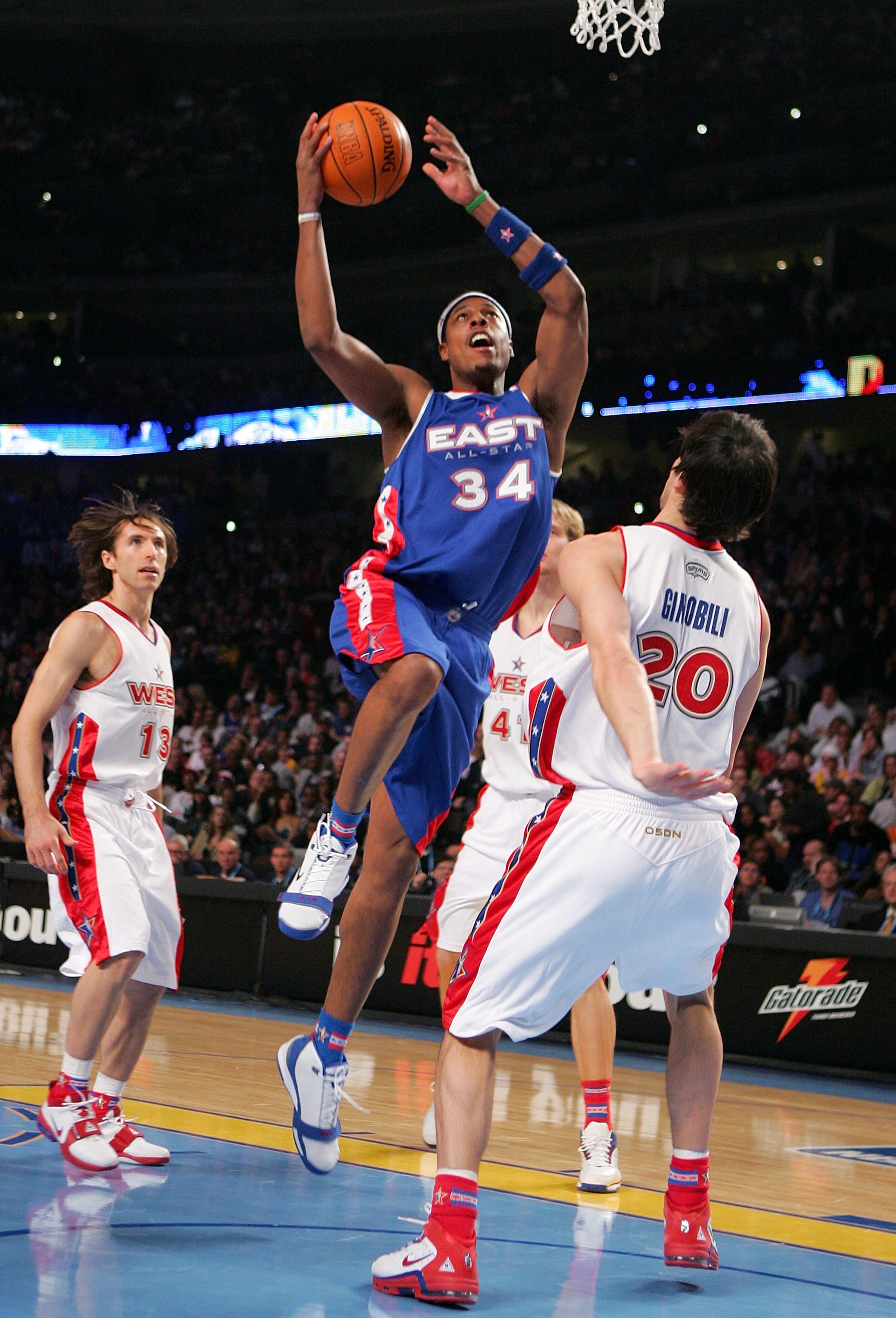 DENVER - FEBRUARY 20: Paul Pierce #34 of the Eastern Conference All-Stars goes to the basket against Manu Ginobili #20 of the Western Conference All-Stars during the 54th All-Star Game, part of 2005 NBA All-Star Weekend at Pepsi Center on February 20, 2 DENVER - FEBRUARY 20: Paul Pierce #34 of the Eastern Conference All-Stars goes to the basket against Manu Ginobili #20 of the Western Conference All-Stars during the 54th All-Star Game, part of 2005 NBA All-Star Weekend at Pepsi Center on February 20, 2