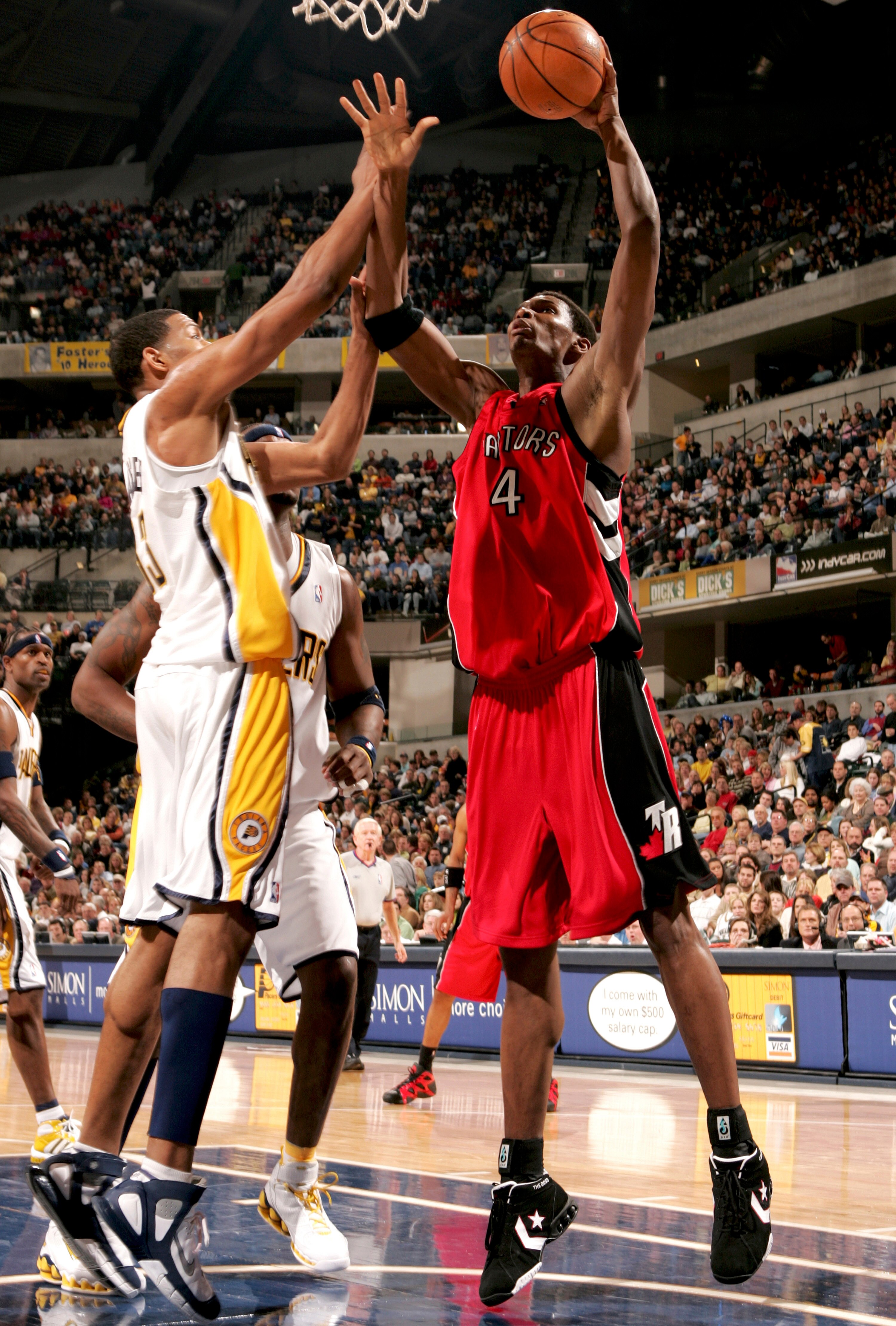 INDIANAPOLIS - DECEMBER 30:  Chris Bosh #4 of the Toronto Raptors shoots the ball against Danny Granger #33 of the Indiana Pacers on December 30, 2005 at Conseco Fieldhouse in Indianapolis, Indiana. The Raptors won 99-97.  NOTE TO USER: User expressly ack