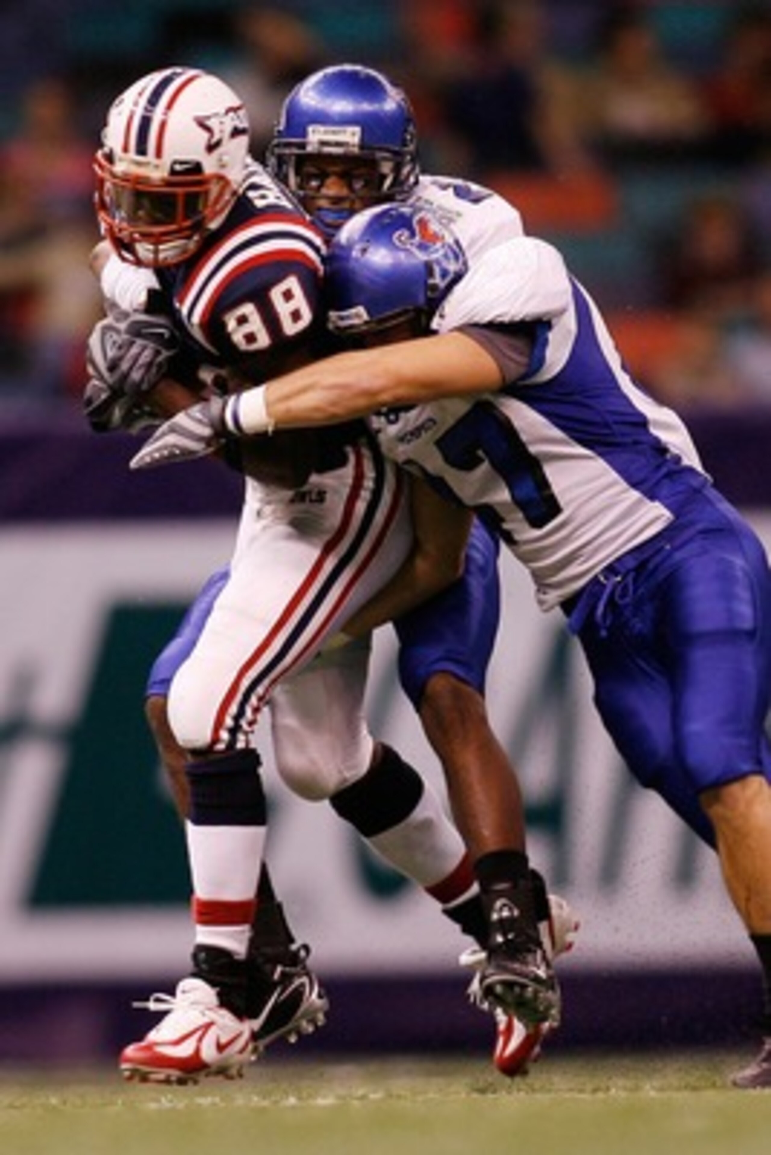 NEW ORLEANS - DECEMBER 21:  Jason Hamon #88 of the Florida Atlantic University Owls is tackled by Jake Kasser #47 of the Memphis University Tigers  in the New Orleans Bowl on December 21, 2007 at the Louisiana Superdome in New Orleans, Louisiana.   (Photo