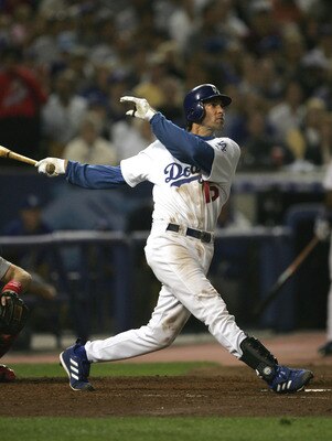 LOS ANGELES - OCTOBER 9: Shawn Green #15 of the Los Angeles Dodgers hits his second home run of the game in the sixth inning against the St. Louis Cardinals during game three of their National League Division Series on October 2, 2004 at Dodger Stadium in
