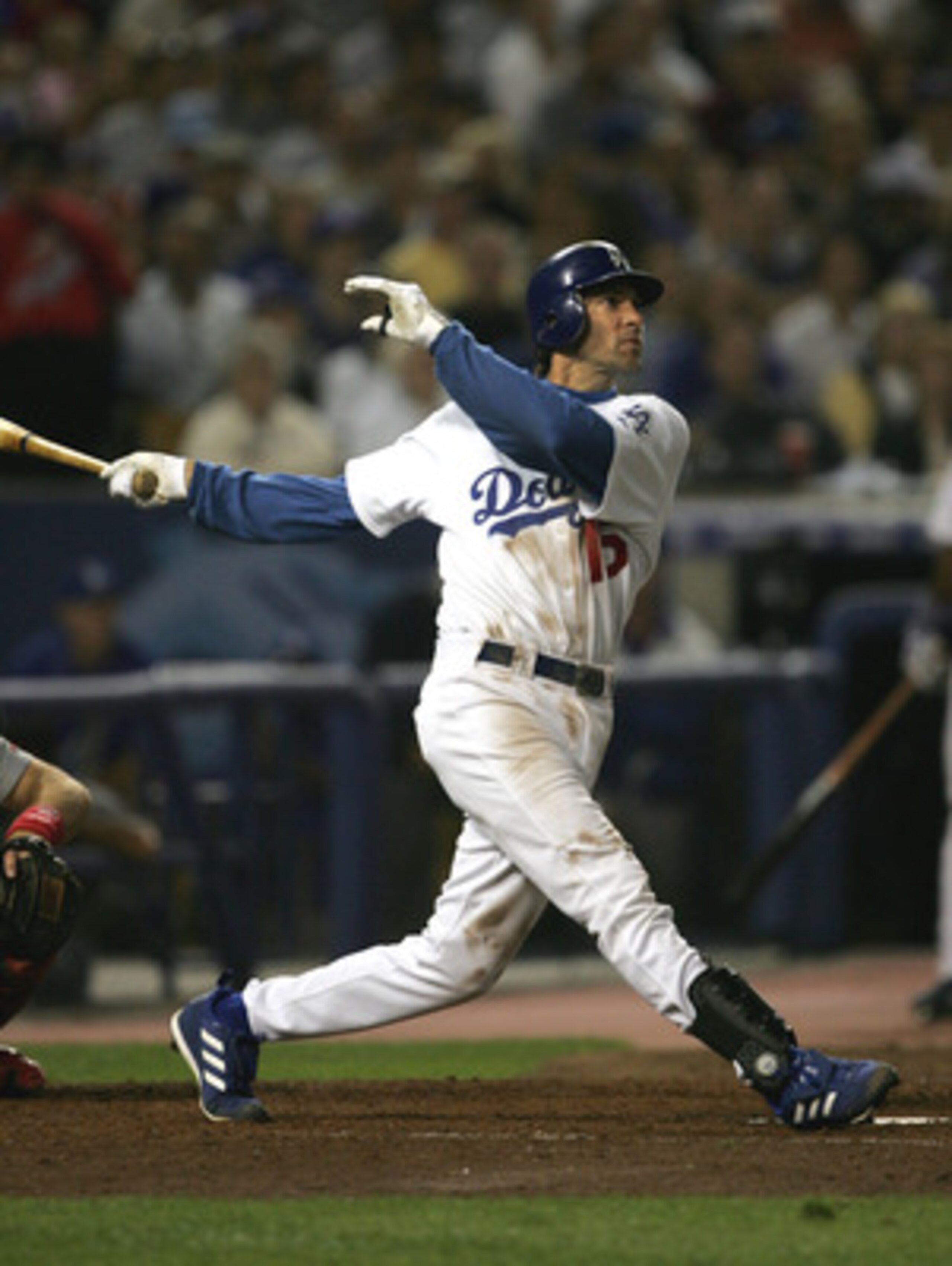 LOS ANGELES - OCTOBER 9: Shawn Green #15 of the Los Angeles Dodgers hits his second home run of the game in the sixth inning against the St. Louis Cardinals during game three of their National League Division Series on October 2, 2004 at Dodger Stadium in