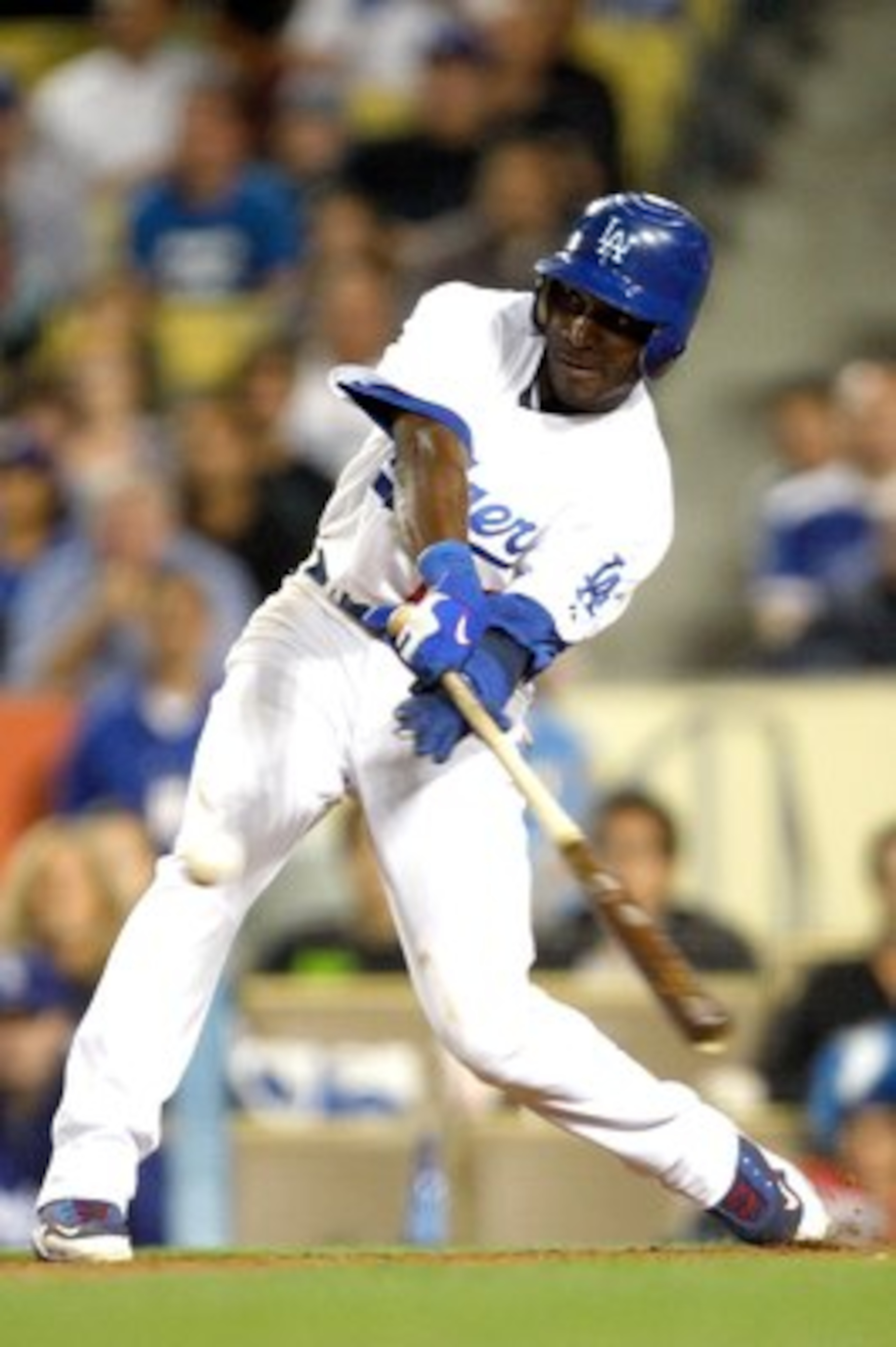 LOS ANGELES, CA - OCTOBER 02:  Orlando Hudson #13 hits the ball during the game against the Colorodo Rockies at Dodger Stadium on October 2, 2009 in Los Angeles, California.  (Photo by Jacob de Golish/Getty Images)
