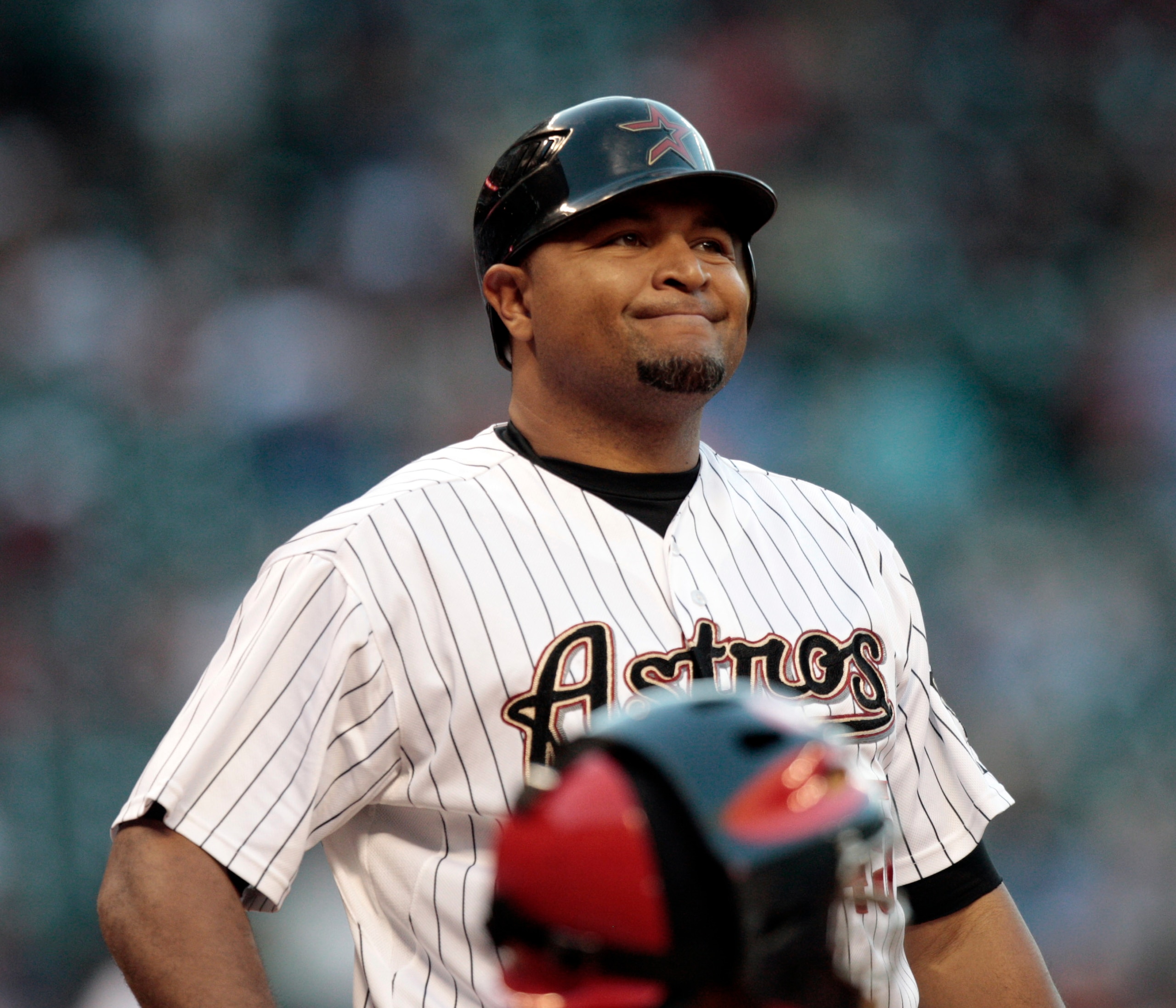 HOUSTON - APRIL 27:  Carlos Lee #45 of the Houston Astros reacts after a strike called against the St. Louis Cardinals at Minute Maid Park on April 27, 2011 in Houston, Texas.  (Photo by Bob Levey/Getty Images)