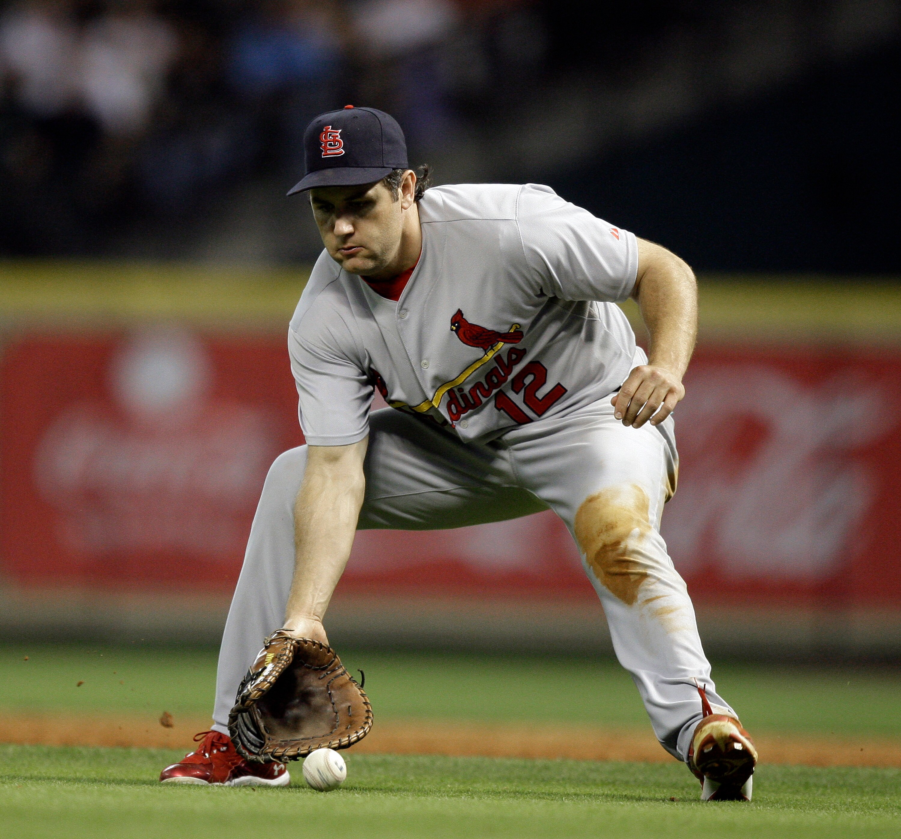 HOUSTON - APRIL 26:  First baseman Lance Berkman #12 of the St. Louis Cardinals fields a ground ball against the Houston Astros at Minute Maid Park on April 26, 2011 in Houston, Texas.  (Photo by Bob Levey/Getty Images)