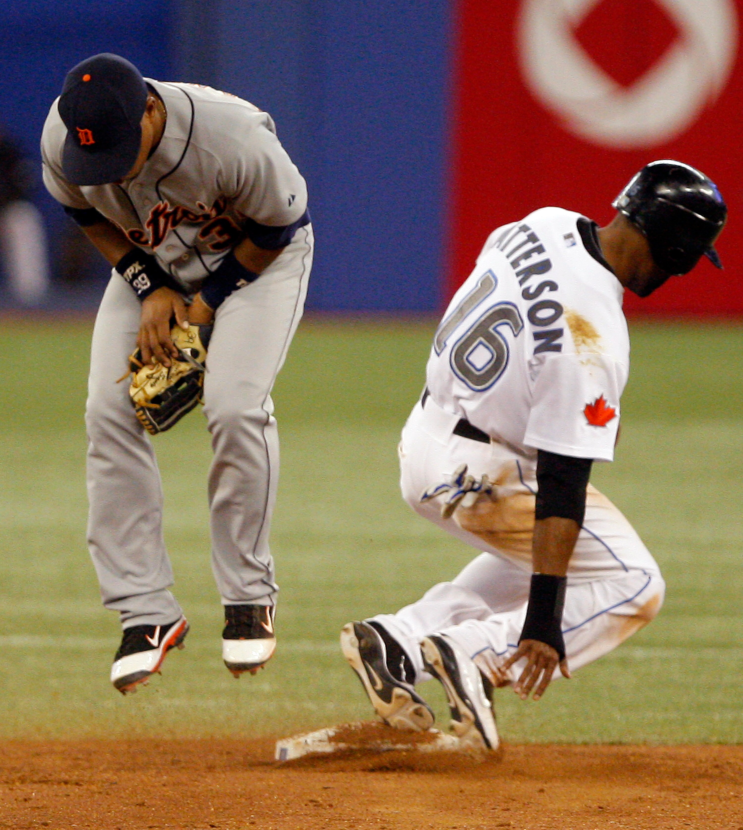 TORONTO, CANADA - MAY 9: Ramon Santiago #39 of the Detroit Tigers misses the ball as Corey Patterson #16 steals second during MLB action at the Rogers Centre May 9, 2011 in Toronto, Ontario, Canada. (Photo by Abelimages/Getty Images)