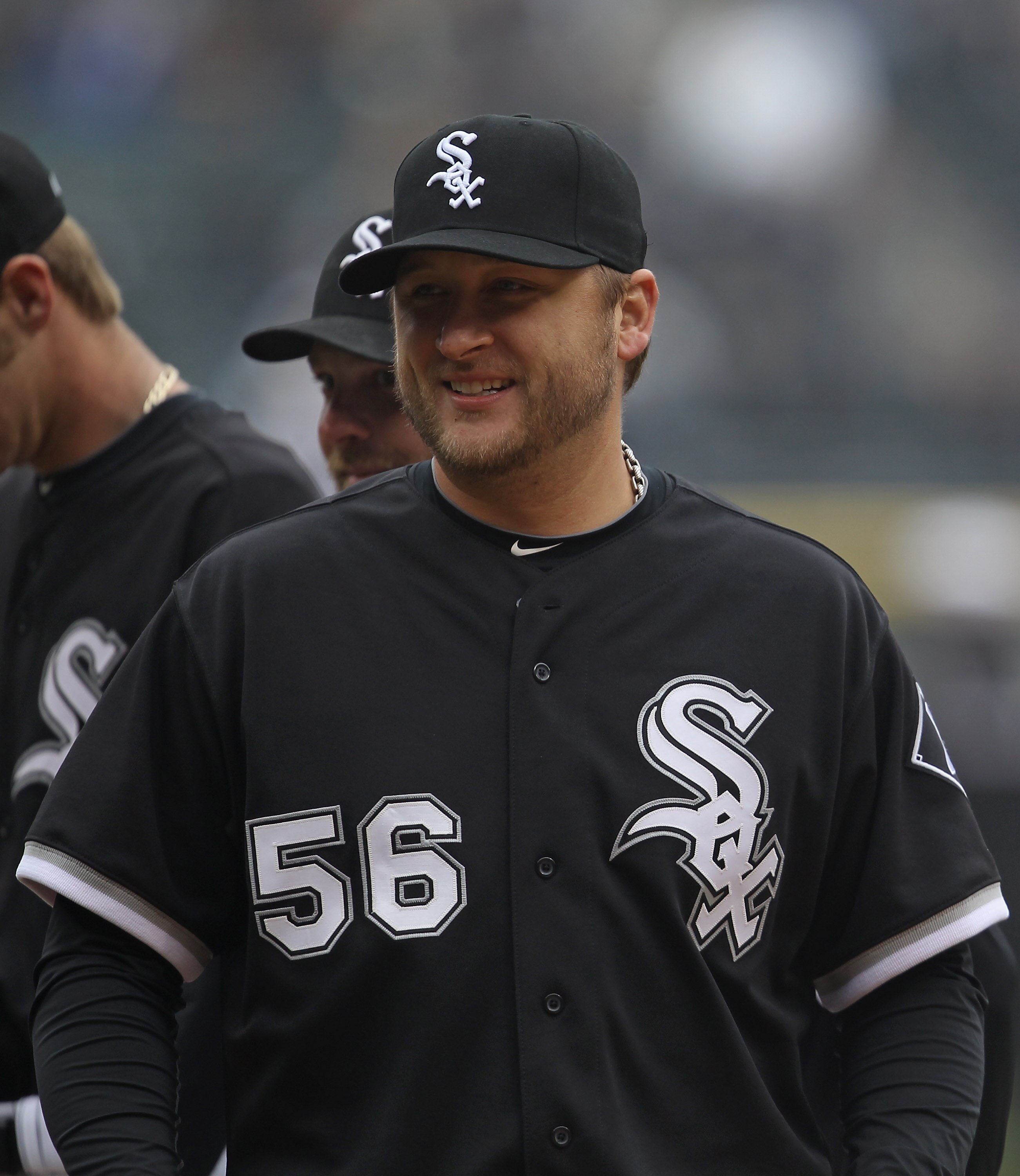 CHICAGO, IL - APRIL 07: Mark Buehrle #56 of the Chicago White Sox smiles at fans during player introductions before the home opener against the Tampa Bay Rays at U.S. Cellular Field on April 7, 2011 in Chicago, Illinois. The White Sox defeated the Rays 5-
