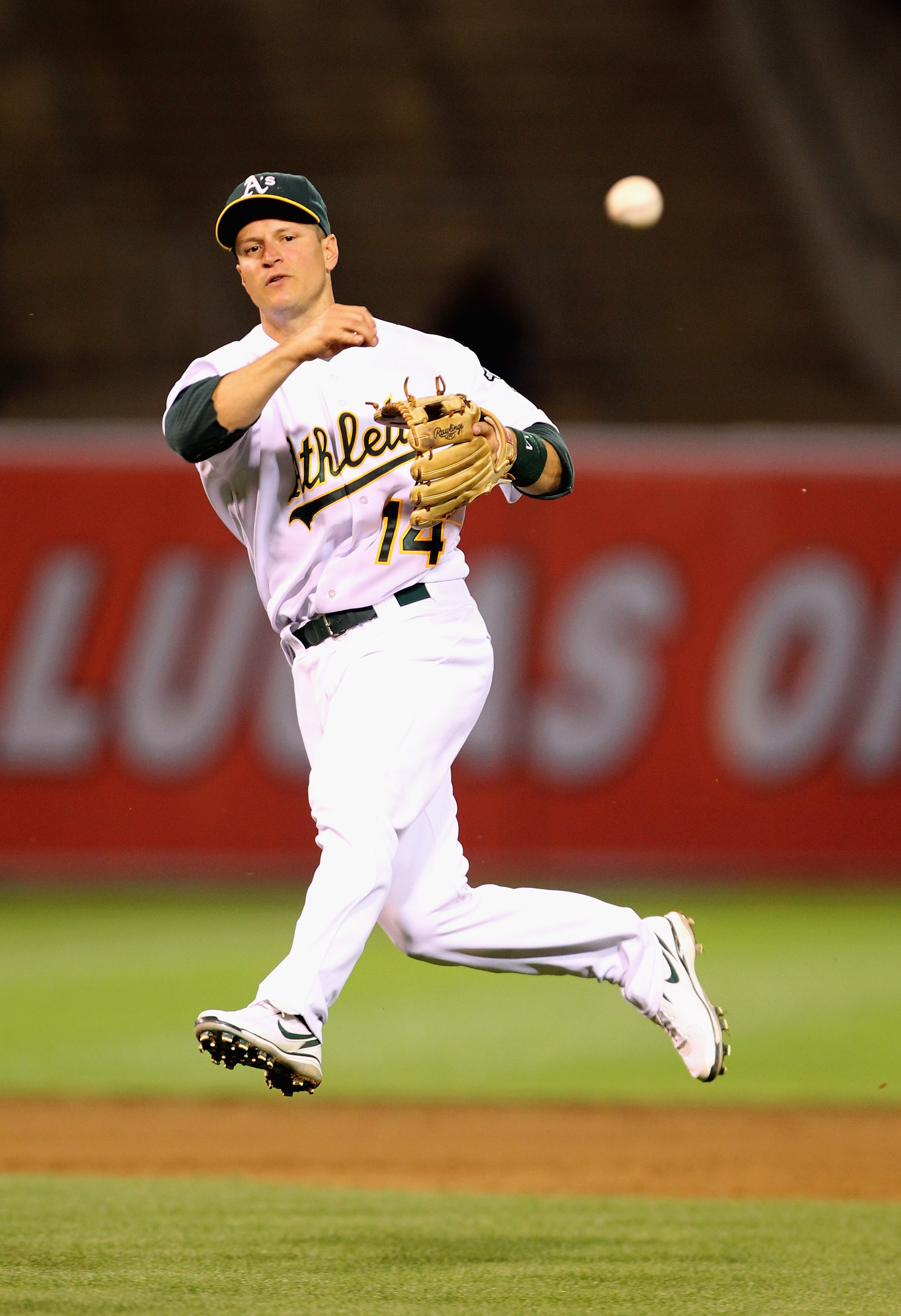 OAKLAND, CA - MAY 03:  Mark Ellis #14 of the Oakland Athletics throws out Shin-Soo Choo #17 of the Cleveland Indians in the sixth inning at Oakland-Alameda County Coliseum on May 3, 2011 in Oakland, California.  (Photo by Ezra Shaw/Getty Images)