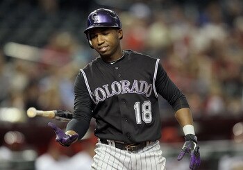 PHOENIX, AZ - MAY 03:  Jonathan Herrera #18 of the Colorado Rockies walks to the dugout during the Major League Baseball against the Arizona Diamondbacks game at Chase Field on May 3, 2011 in Phoenix, Arizona.  The Diamondbacks defeated the Rockies 4-3.