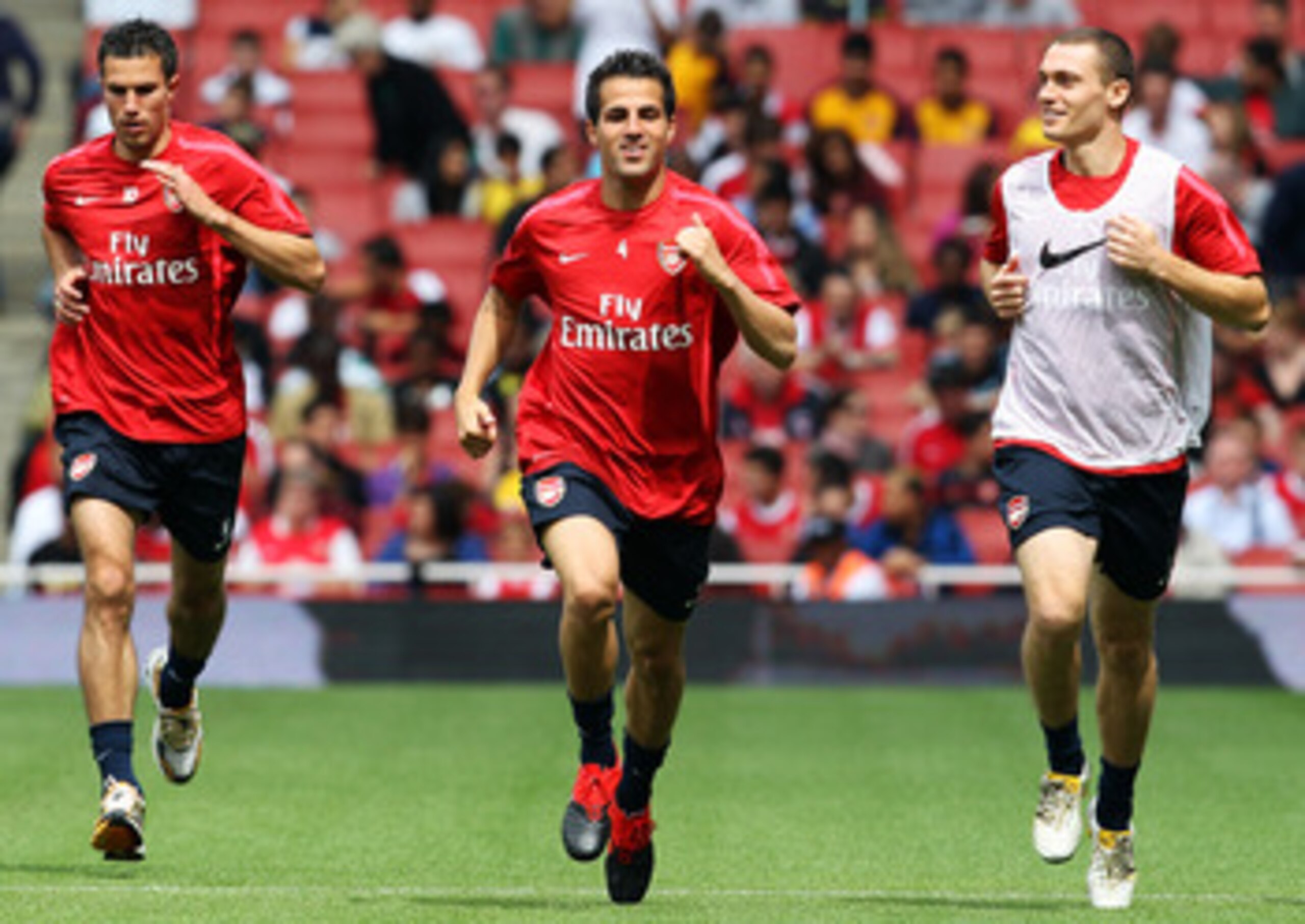 LONDON, ENGLAND - AUGUST 05:  (l to r) Robin Van Persie, Cesc Fabregas and Thomas Vermaelen attend an Arsenal open training session at Emirates Stadium on August 5, 2010 in London, England.  (Photo by Bryn Lennon/Getty Images)