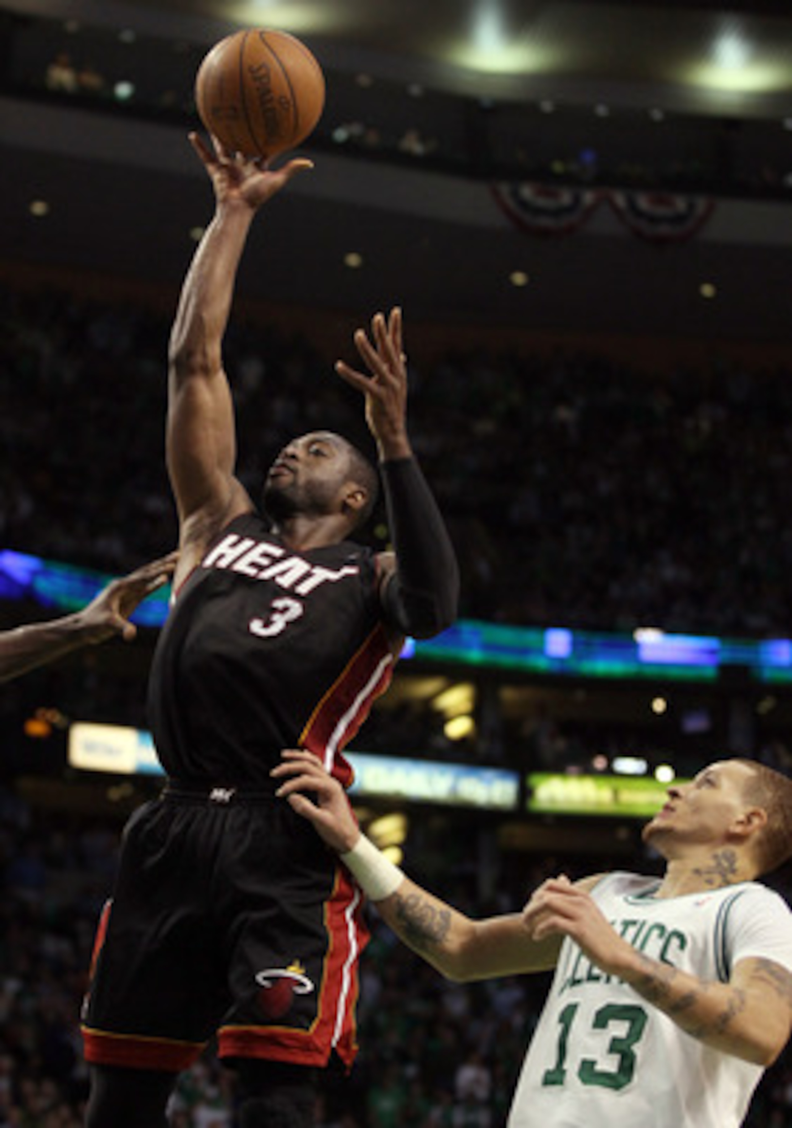 BOSTON, MA - MAY 09: Dwyane Wade #3 of the Miami Heat takes a shot as Delonte West #13 of the Boston Celtics defends in Game Four of the Eastern Conference Semifinals in the 2011 NBA Playoffs on May 9, 2011 at the TD Garden in Boston, Massachusetts.  The