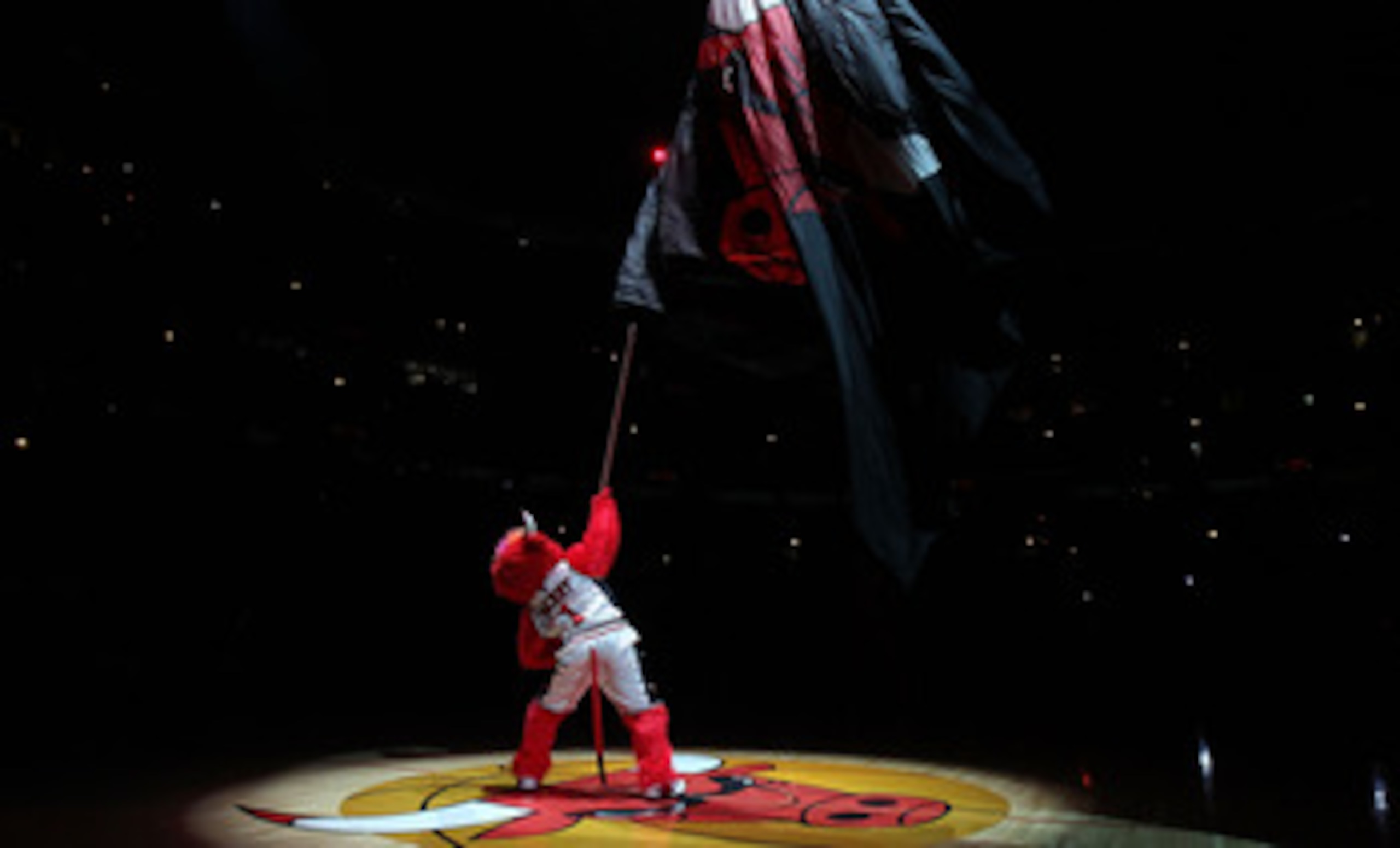 CHICAGO, IL - MARCH 07: Benny, the mascot of the Chicago Bulls, waves a flag before a game against the New Orleans Hornets at the United Center on March 7, 2011 in Chicago, Illinois. The Bulls defeated the Hornets 85-77. NOTE TO USER: User expressly ackno