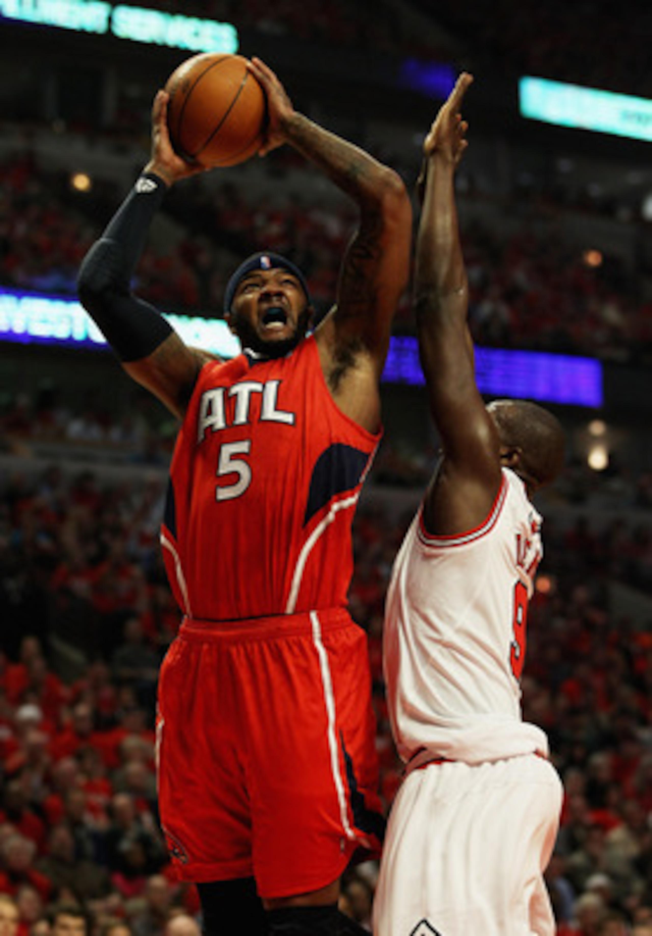 CHICAGO, IL - MAY 10: Josh Smith #5 of the Atlanta Hawks puts up a shot over Loul Deng #9 of the Chicago Bulls in Game Five of the Eastern Conference Semifinals in the 2011 NBA Playoffs at the United Center on May 10, 2011 in Chicago, Illinois. NOTE TO US