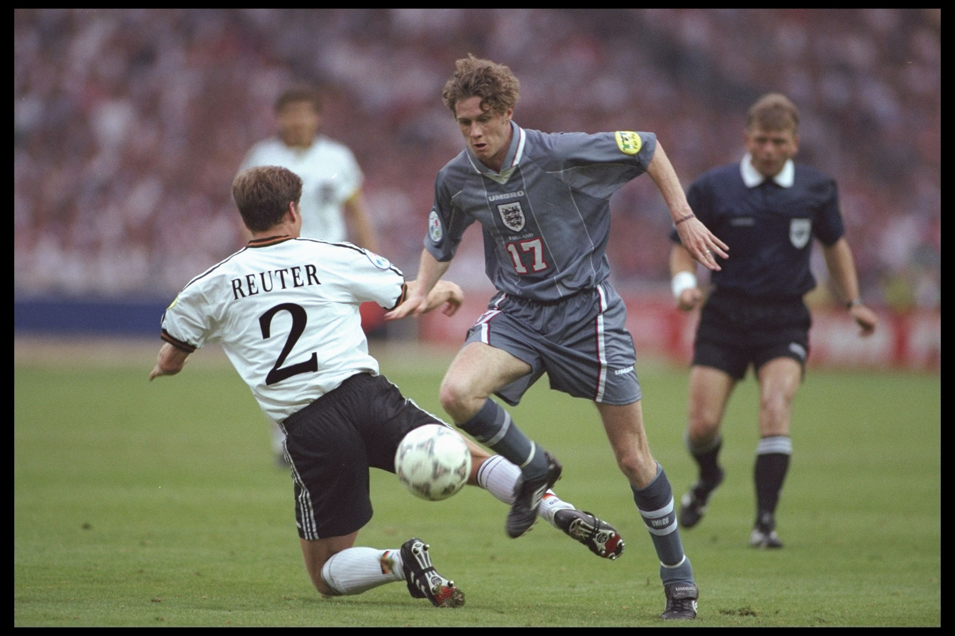 26 Jun 1996: Steve McManaman of England (number 17) goes round Stefan Reuter of Germany during the European soccer championships semi final match between England and Germany at Wembley Stadium, London. Germany won the match after extra time in a penaltys 26 Jun 1996: Steve McManaman of England (number 17) goes round Stefan Reuter of Germany during the European soccer championships semi final match between England and Germany at Wembley Stadium, London. Germany won the match after extra time in a penaltys