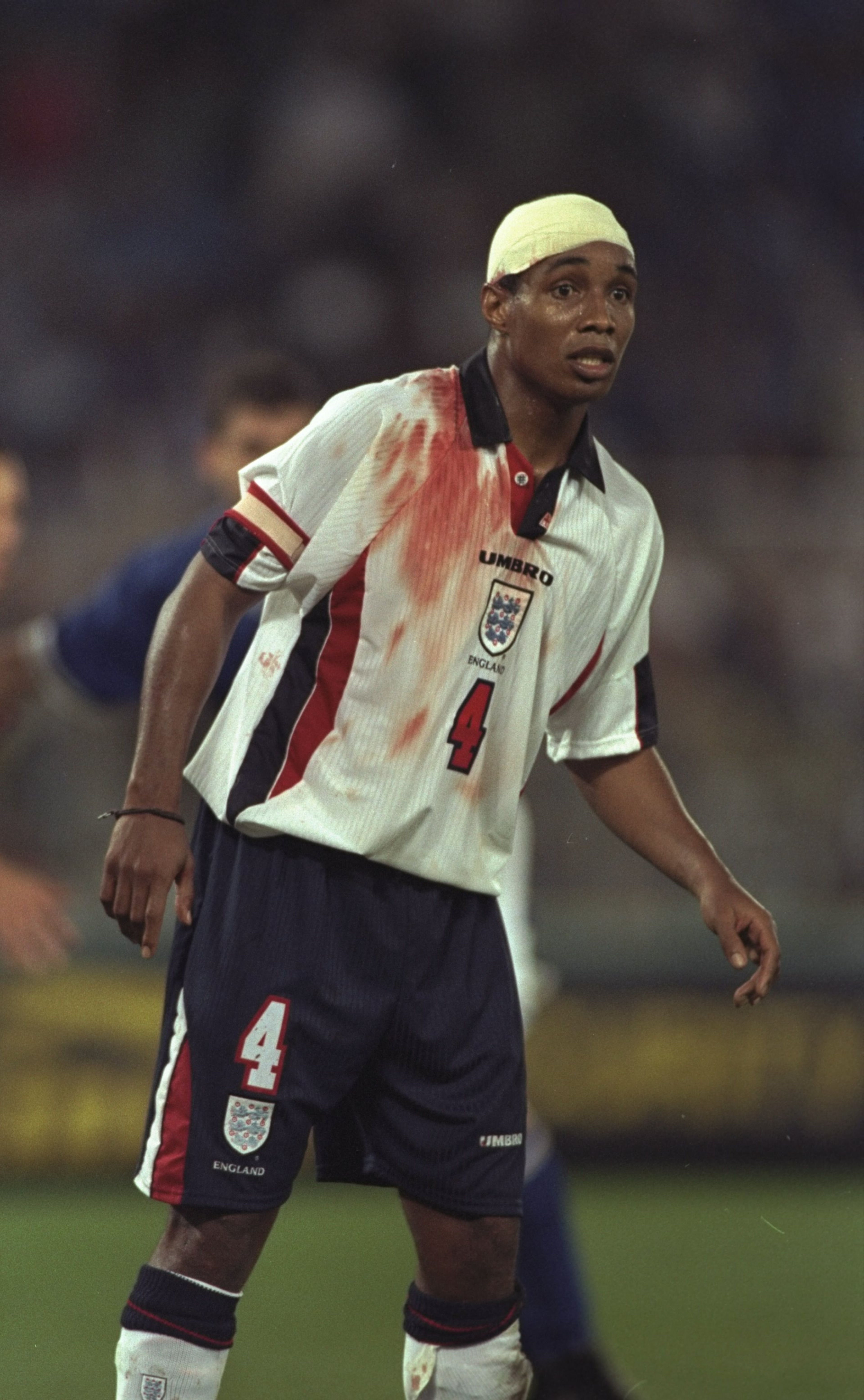 11 Oct 1997: Paul Ince of England sports a bandage and blood stained shirt during the World Cup Qualifier against Italy at the Olympic Stadium in Rome, Italy. The game ended 0-0 and England qualified for the World Cup finals. \ Mandatory Credit: Shaun B 11 Oct 1997: Paul Ince of England sports a bandage and blood stained shirt during the World Cup Qualifier against Italy at the Olympic Stadium in Rome, Italy. The game ended 0-0 and England qualified for the World Cup finals. \ Mandatory Credit: Shaun B