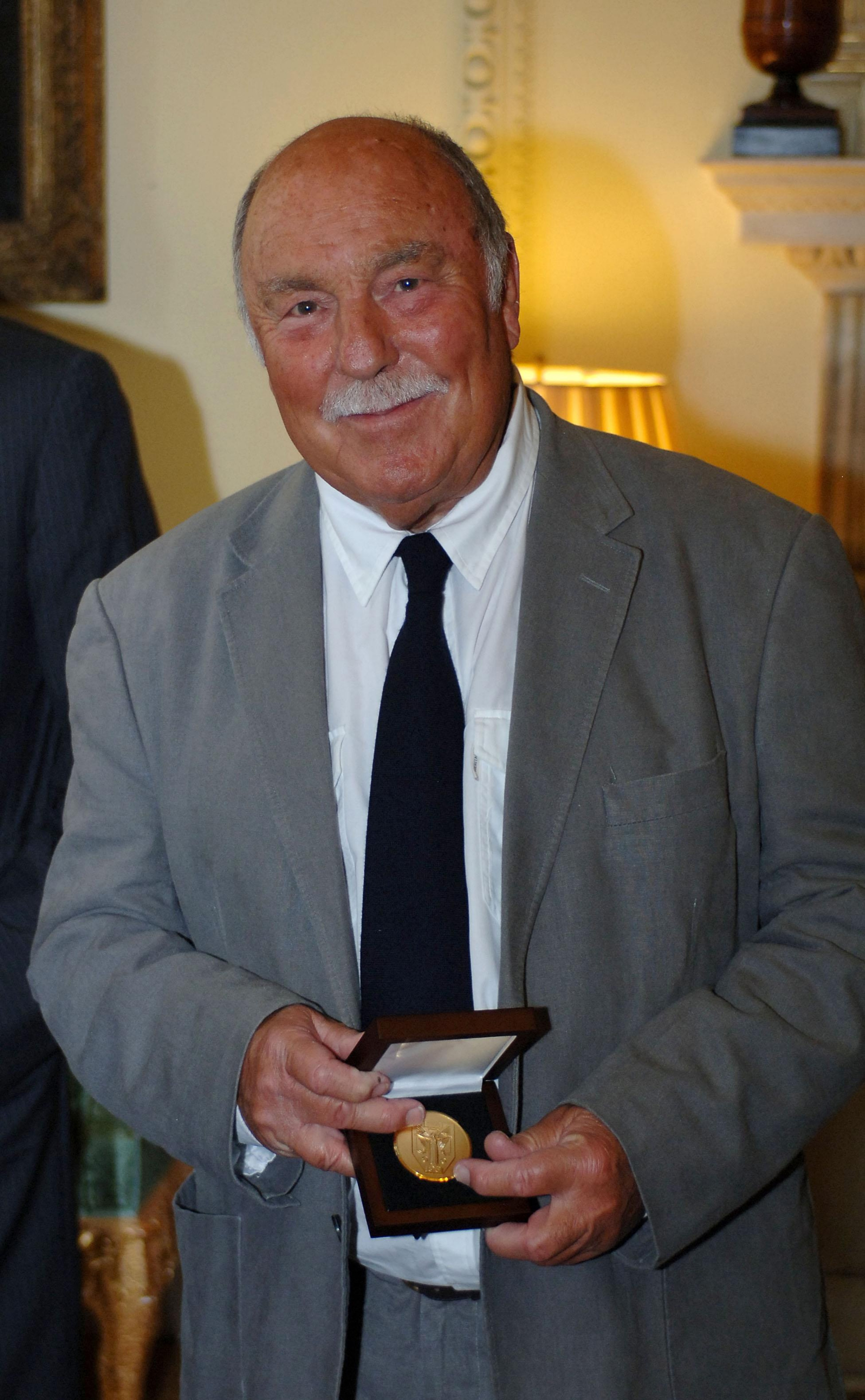LONDON, UNITED KINGDOM - JUNE 10: Jimmy Greaves smiles after collecting his medal presented by Prime Minister Gordon Brown for representing his country in the 1966 World Cup at Downing Street on June 10, 2009 in London England. When England lifted the Wor LONDON, UNITED KINGDOM - JUNE 10: Jimmy Greaves smiles after collecting his medal presented by Prime Minister Gordon Brown for representing his country in the 1966 World Cup at Downing Street on June 10, 2009 in London England. When England lifted the Wor