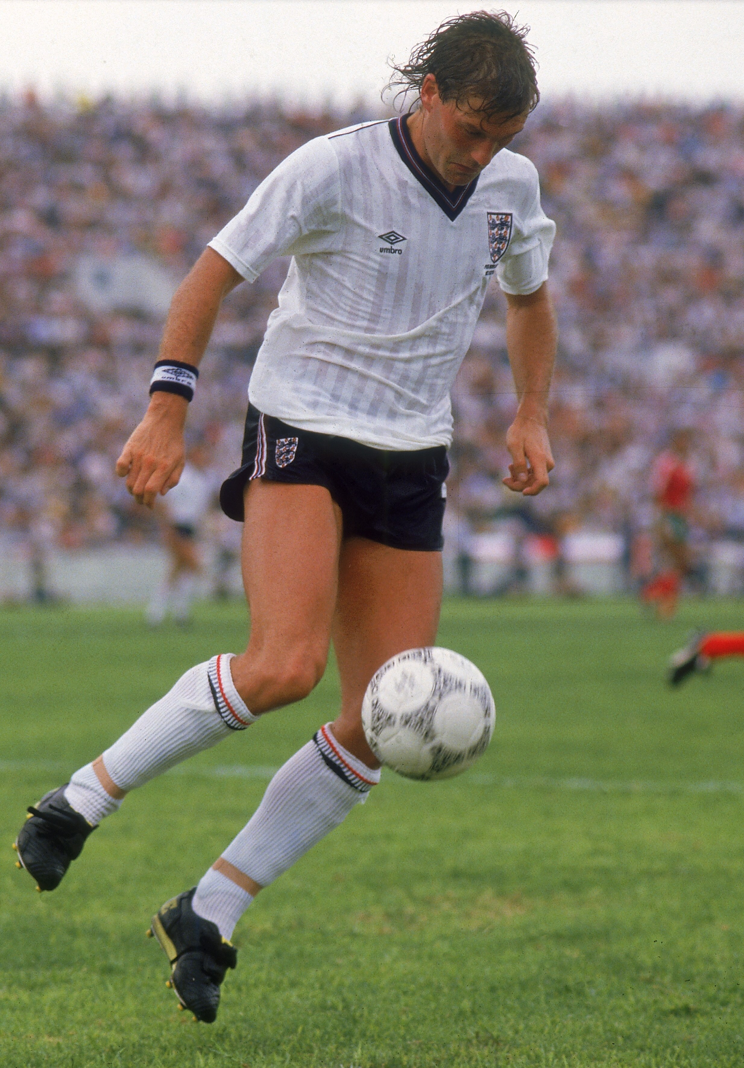 MONTERREY - JUNE 3:  Glenn Hoddle of England runs with the ball during the FIFA World Cup Finals 1986 Group F match between Portugal and England held on June 3, 1986 at the Tecnologico Stadium, in Monterrey, Mexico. Portugal won the match 1-0. (Photo by D