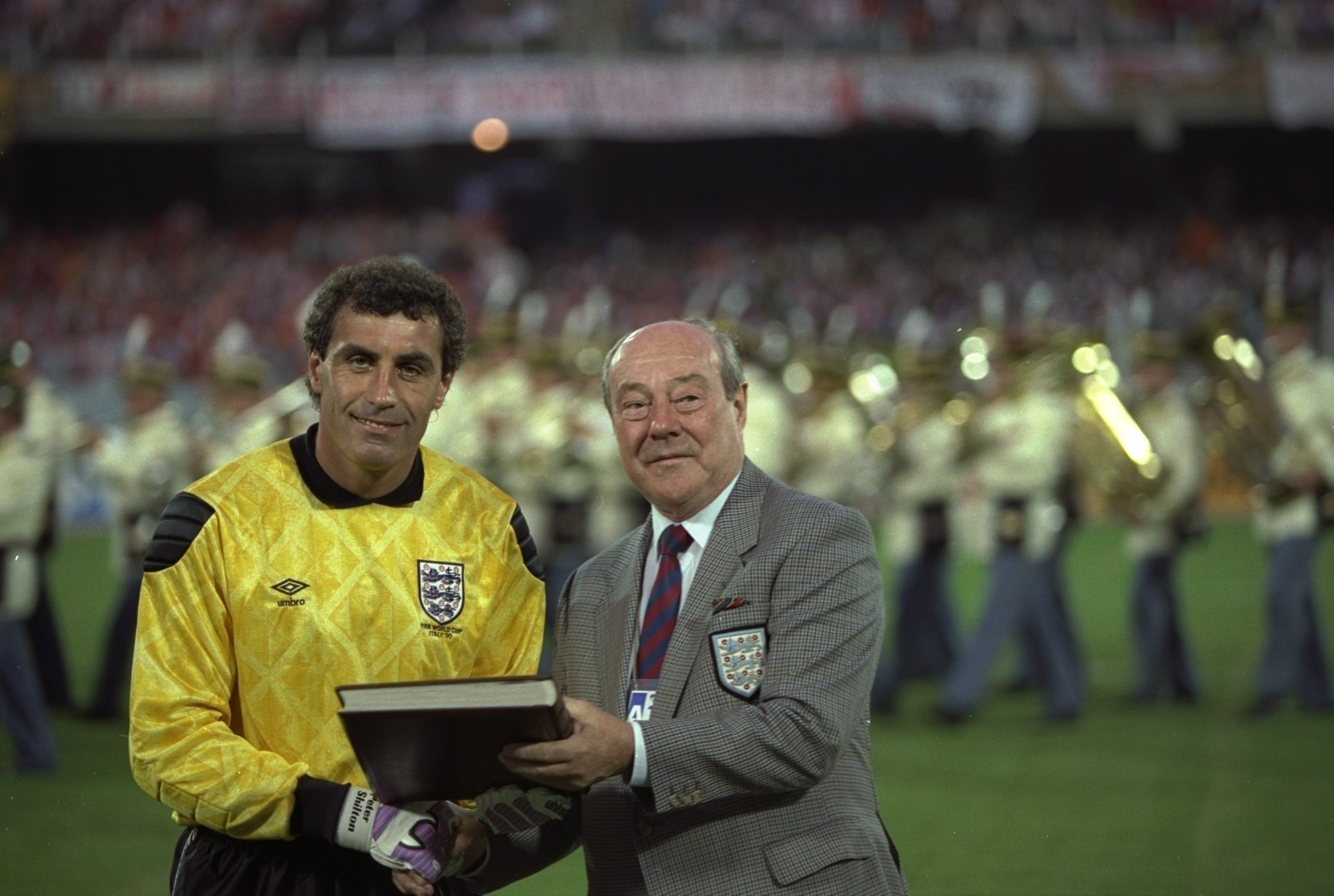16 Jun 1990: Peter Shilton (left) of England is awarded his 125th and World Record England Cap by Sir Bert Millichip (right) before the World Cup match against Holland in Cagliari, Italy. The match ended in a 0-0 draw. \ Mandatory Credit: David Cannon/A 16 Jun 1990: Peter Shilton (left) of England is awarded his 125th and World Record England Cap by Sir Bert Millichip (right) before the World Cup match against Holland in Cagliari, Italy. The match ended in a 0-0 draw. \ Mandatory Credit: David Cannon/A