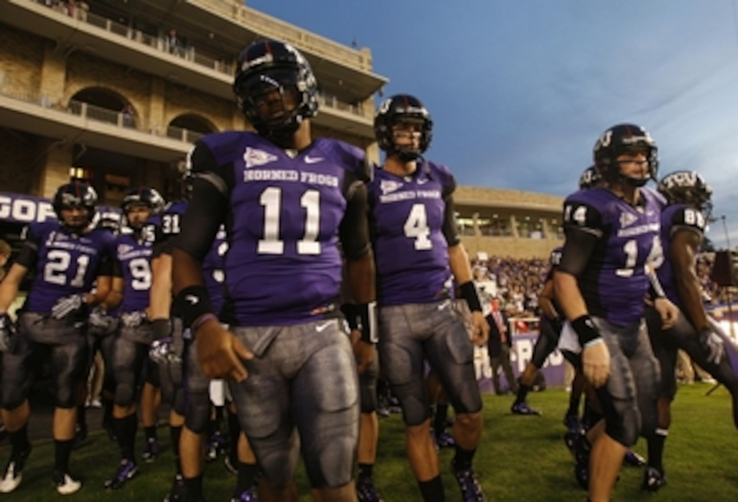 FORT WORTH, TX - NOVEMBER 14: Quarterbacks Marcus Jackson #11 and Casey Pachall #4 of the TCU Horned Frogs take the field before the game against the Utah Utes at Amon G. Carter Stadium on November 14, 2009 in Fort Worth, Texas.  (Photo by Ronald Martinez