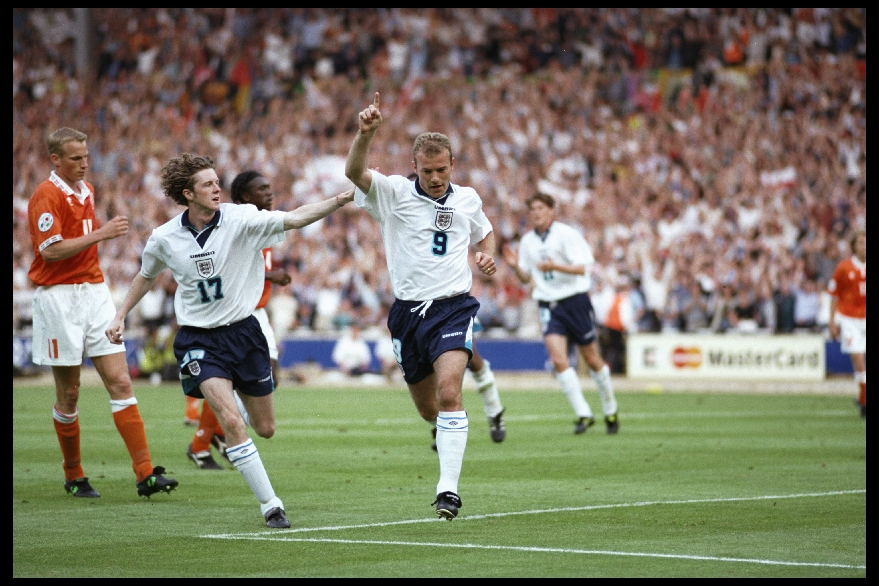 18 Jun 1996:  Steve McManaman helps Alan Shearer celebrate his second goal for England against Holland in the Group A match at Wembley during the European Football Championships. England beat Holland 4-1.