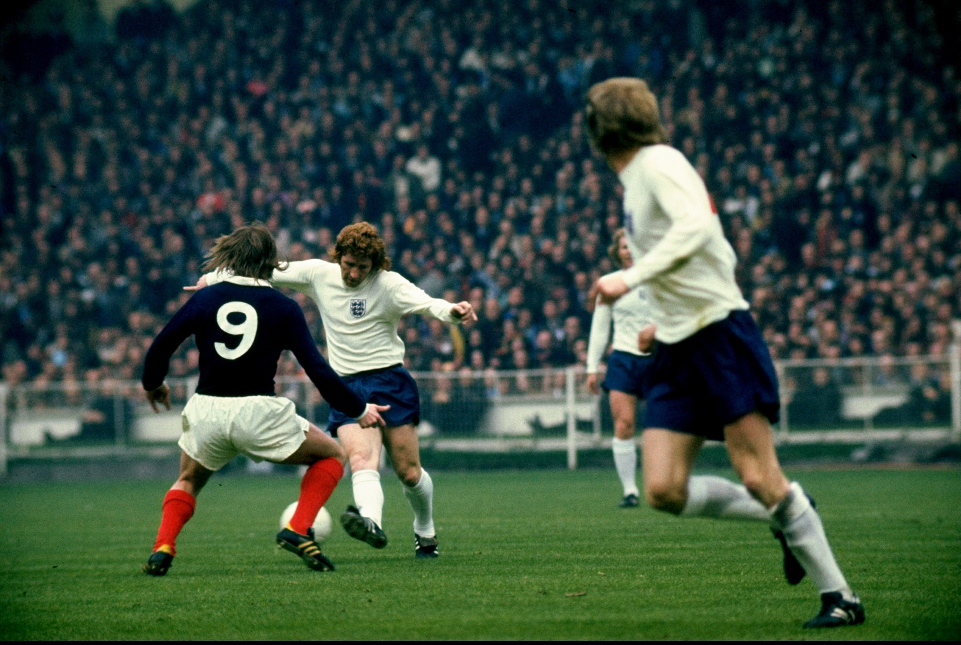 19 May 1973:  Alan Ball of England takes on Kenny Dalglish of Scotland during the international match against Scotland played at Wembley Stadium in London, England.  England won the match 1-0. \ Mandatory Credit: Allsport UK /Allsport