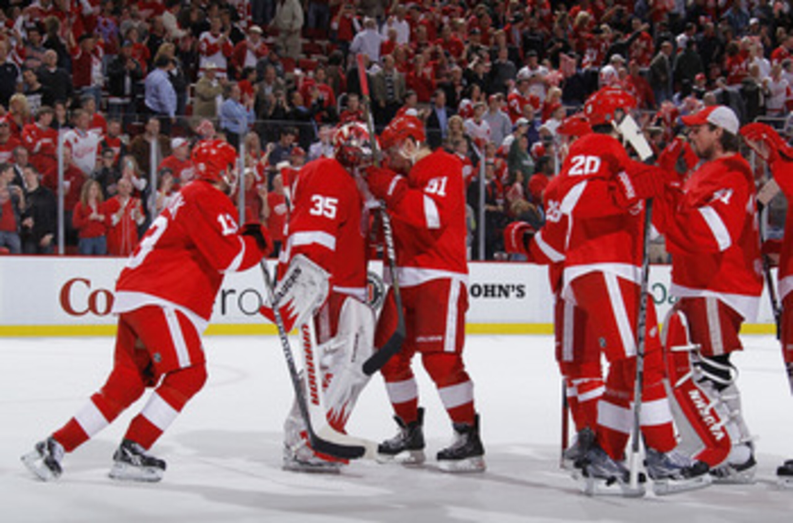 DETROIT - MAY 10: Jimmy Howard #35 of the Detroit Red Wings celebrates a 3-1 victory with teammates over the San Jose Sharks in Game Six of the Western Conference Semifinals during the 2011 NHL Stanley Cup Playoffs on May 10, 2011 at Joe Louis Arena in De
