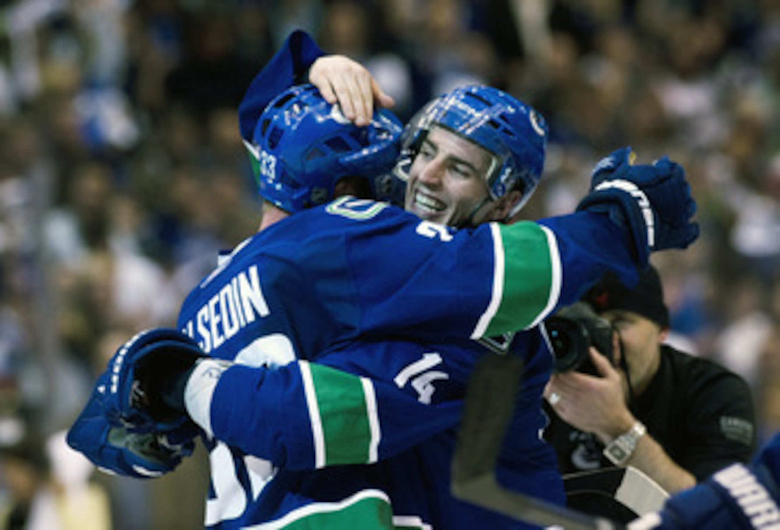 VANCOUVER, CANADA - APRIL 26: Alexandre Burrows #14 (right) of the Vancouver Canucks celebrates with Henrik Sedin #33 of the Vancouver Canucks after scoring the game winning goal against the Chicago Blackhawks during the overtime period in Game Seven of t