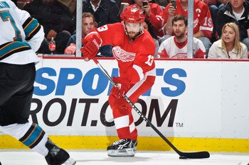 DETROIT - MAY 4: Pavel Datsyuk #13 of the Detroit Red Wings skates with the puck against the San Jose Sharks in Game Three of the Western Conference Semifinals during the 2011 NHL Stanley Cup Playoffs on May 4, 2011 at Joe Louis Arena in Detroit, Michigan