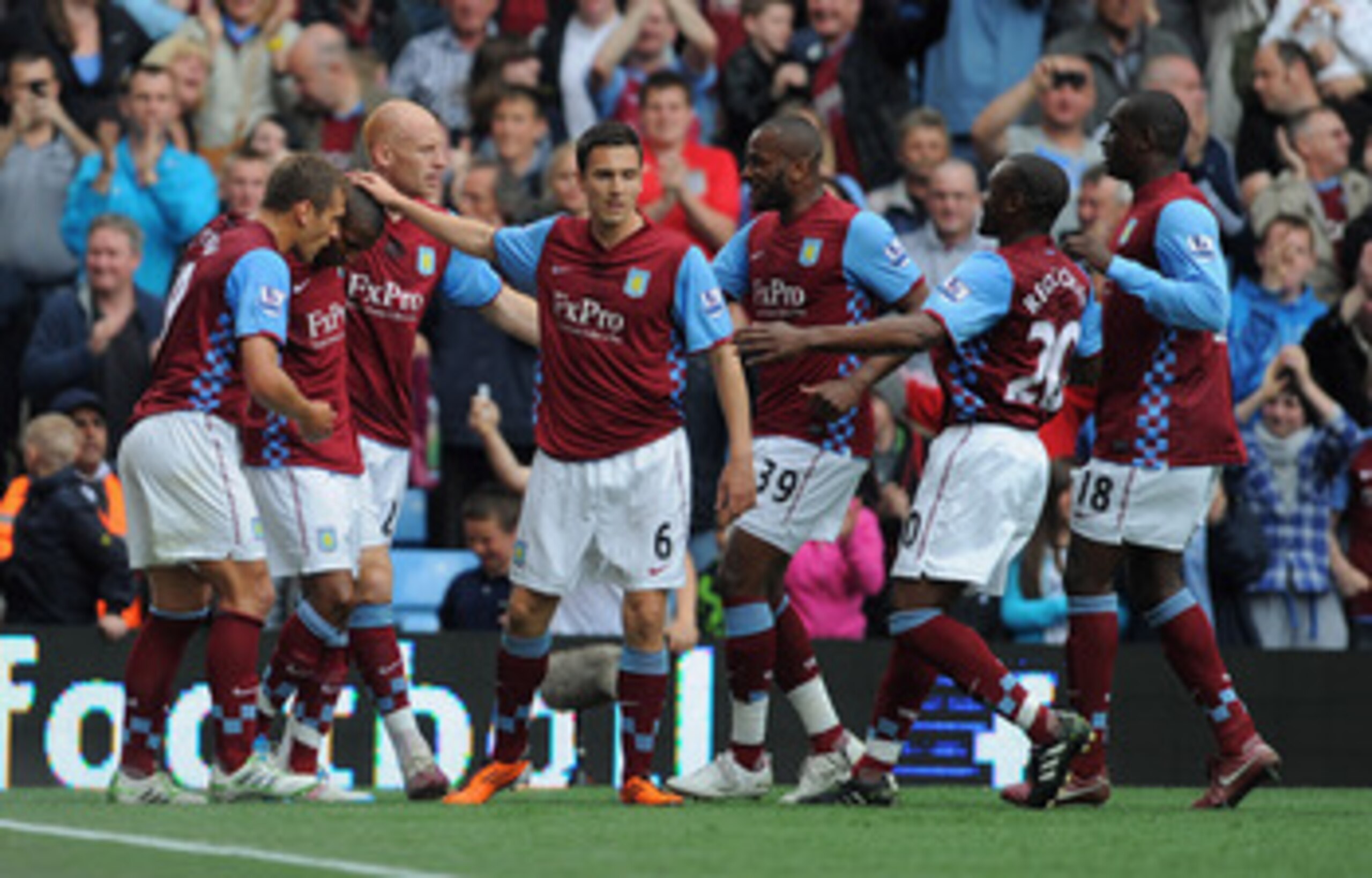 BIRMINGHAM, ENGLAND - MAY 07: Ashley Young of Aston Villa celebrates with team mates after scoring to make it 1-1 during the Barclays Premier League match between Aston Villa and Wigan Athletic on May 7, 2011 in Birmingham, England.  (Photo by Michael Reg