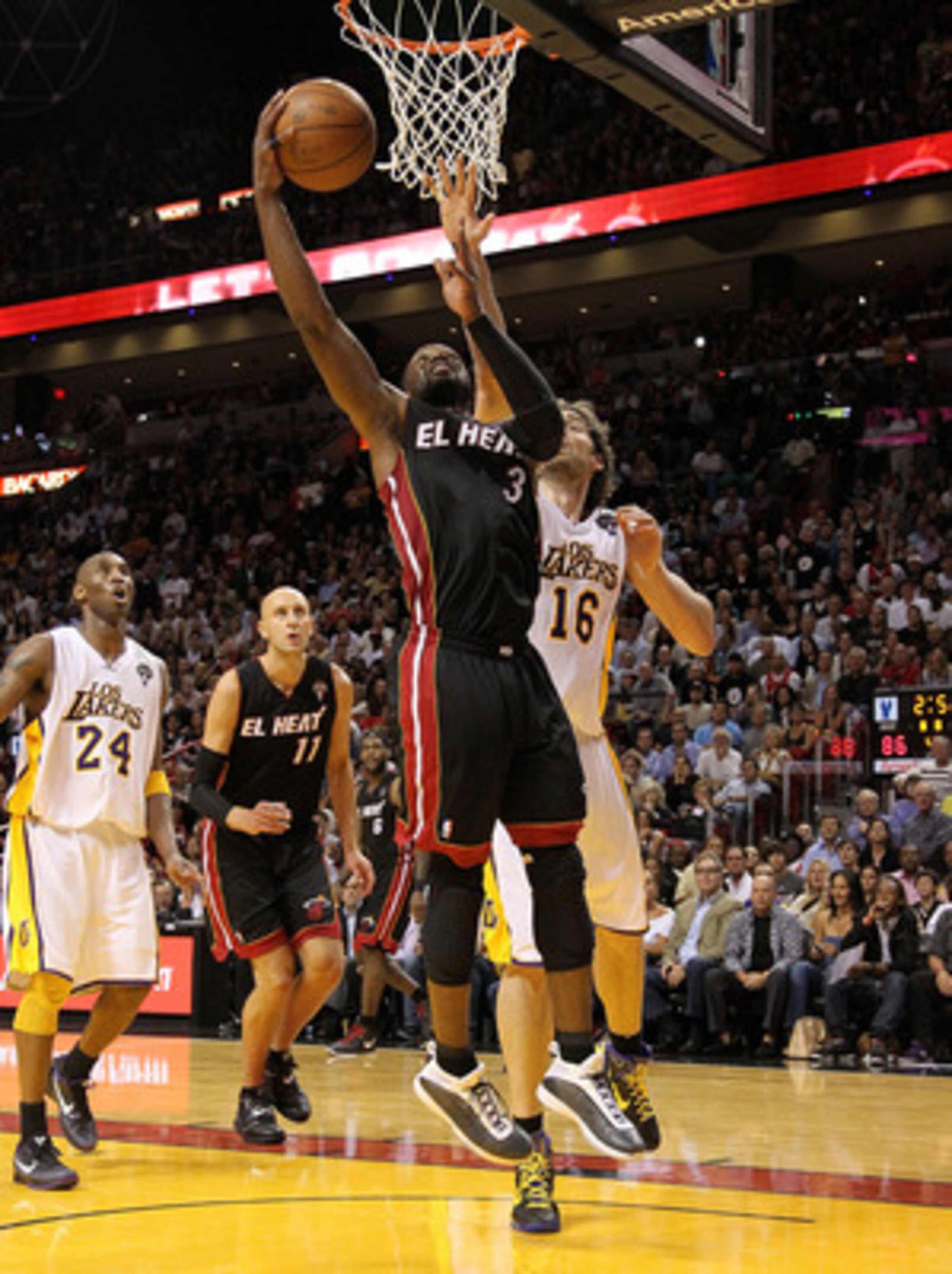 MIAMI, FL - MARCH 10:  Dwyane Wade #3 of the Miami Heat shoots over Pau Gasol #16 of  the Los Angeles Lakers  during a game at American Airlines Arena on March 10, 2011 in Miami, Florida. NOTE TO USER: User expressly acknowledges and agrees that, by downl