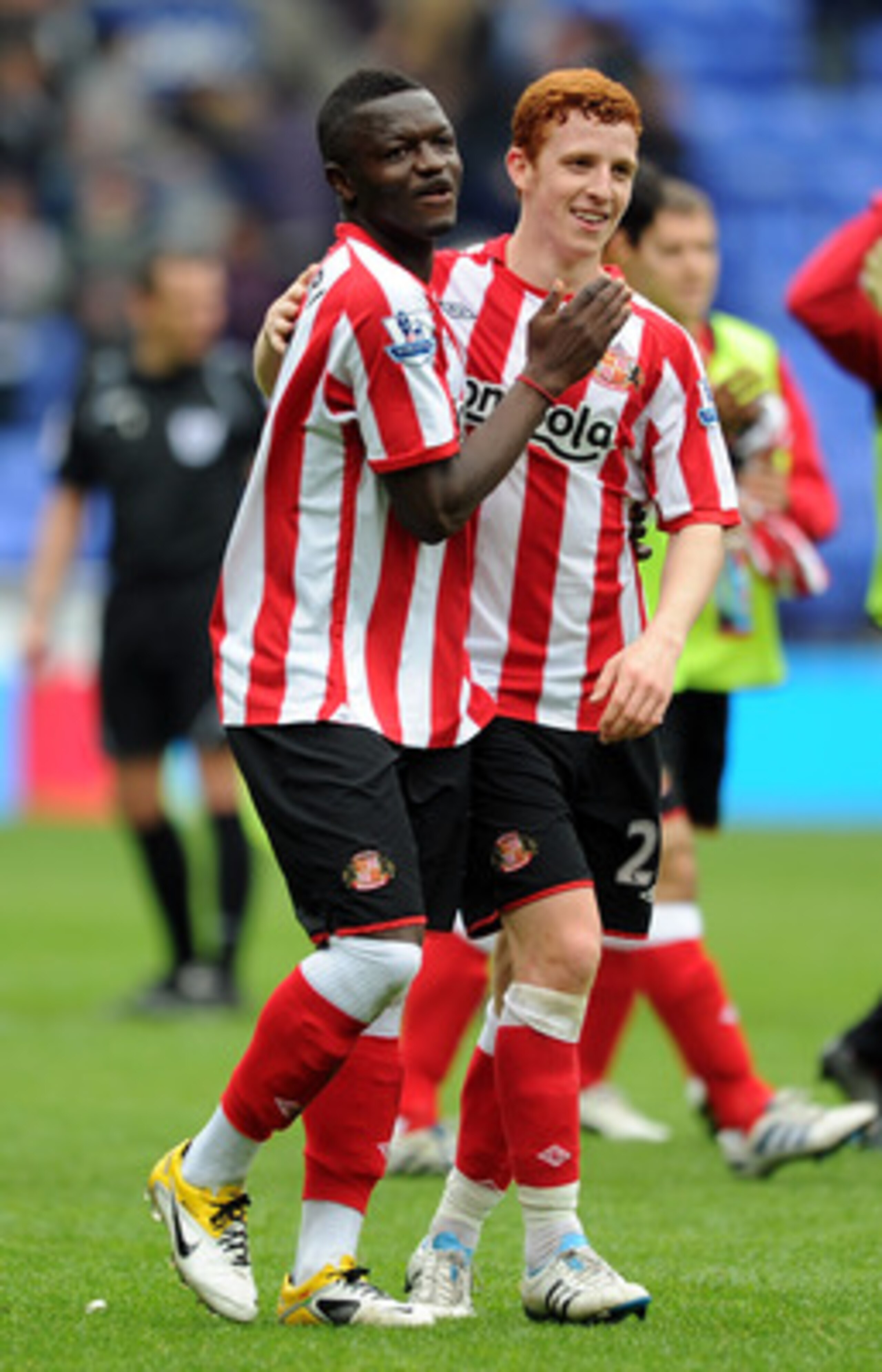 BOLTON, ENGLAND - MAY 07:  Sulley Muntari of Sunderland celebrates at full-time with team-mate Jack Colback (R) following the Barclays Premier League match between Bolton Wanderers and Sunderland at Reebok Stadium on May 7, 2011 in Bolton, England.  (Phot