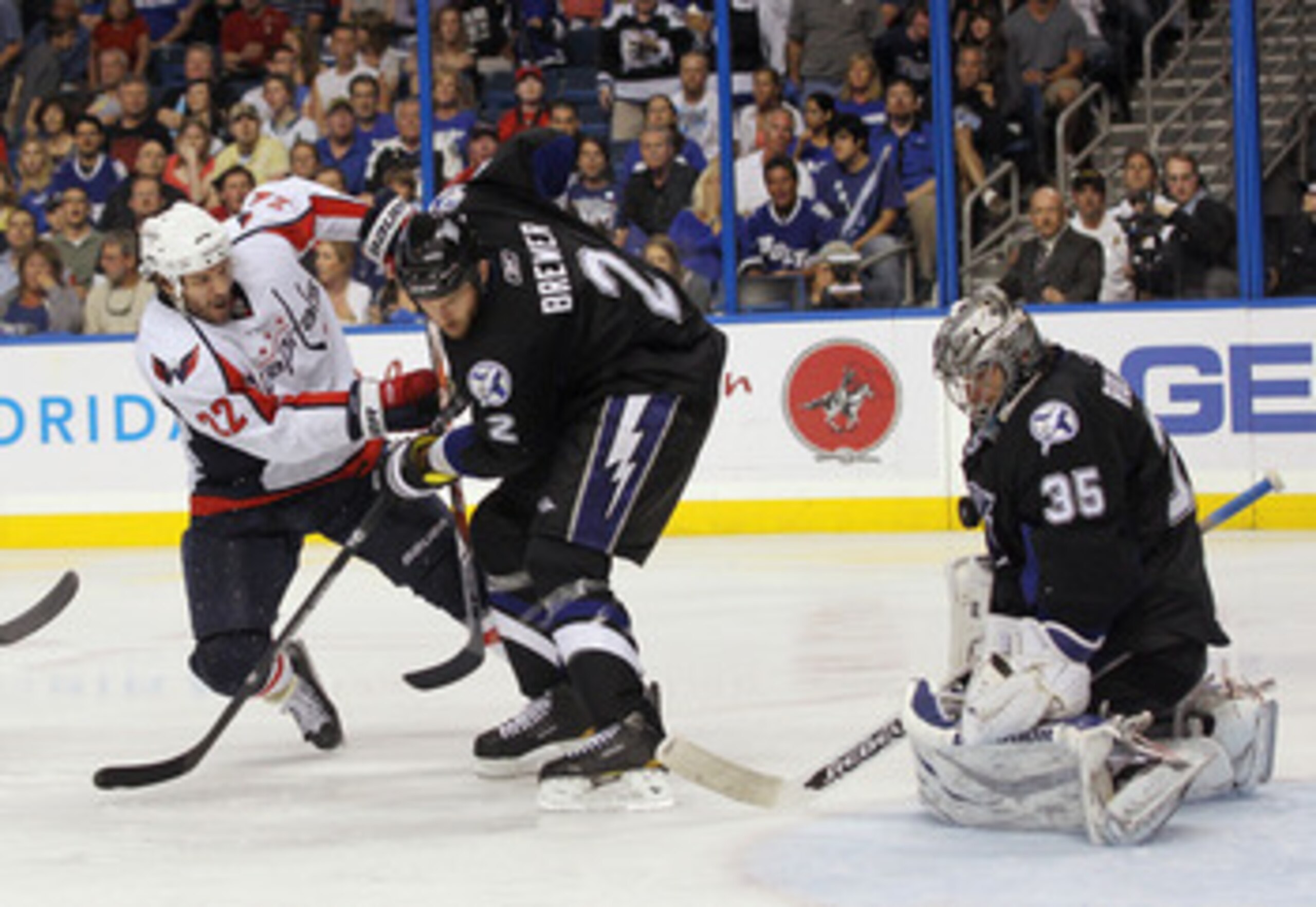TAMPA, FL - MAY 04: Dwayne Roloson #35 of the Tampa Bay Lightning makes the save on Mike Knuble #22 of the Washington Capitals as Eric Brewer #2 assists him in Game Four of the Eastern Conference Semifinals during the 2011 NHL Stanley Cup Playoffs at the 
