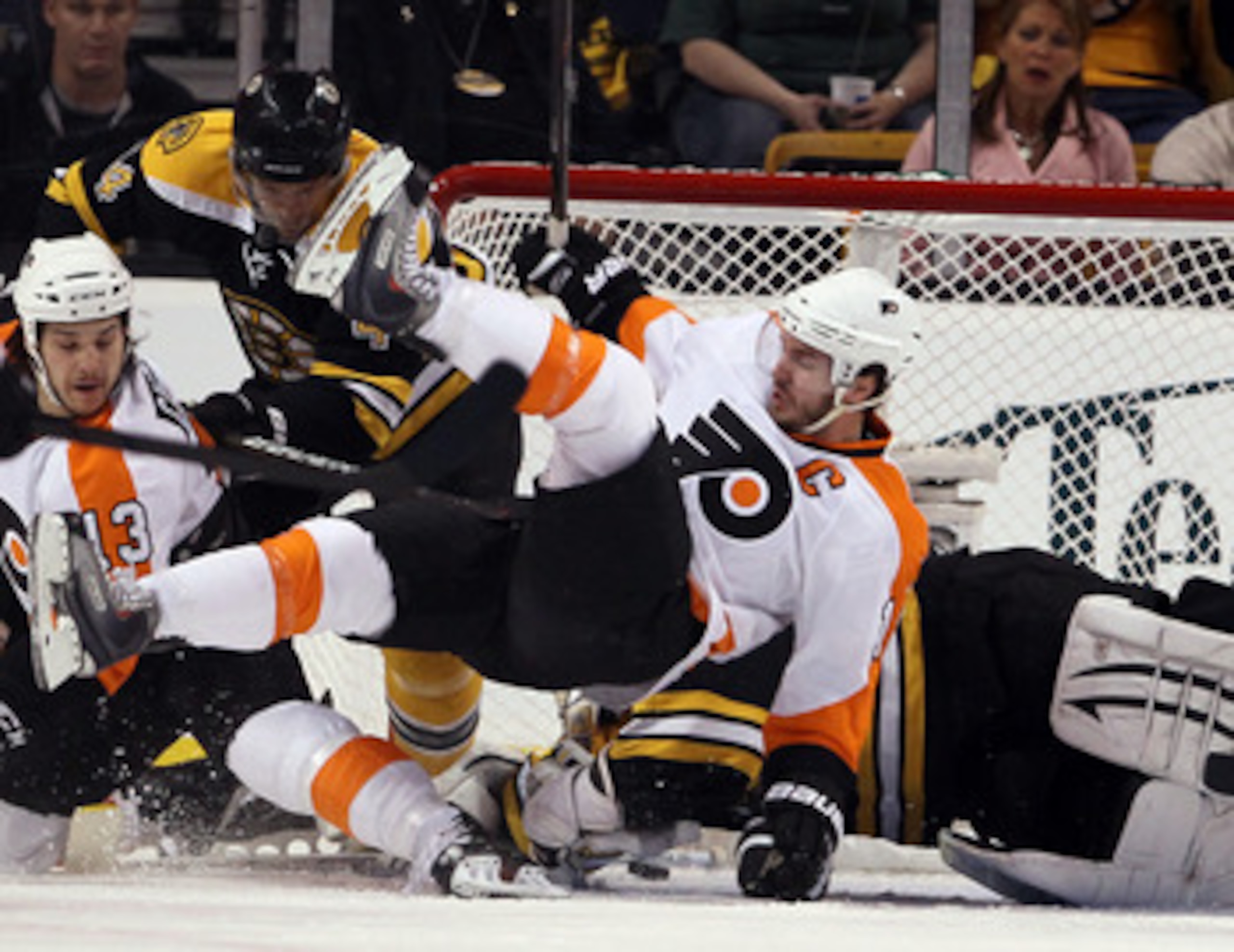 BOSTON, MA - MAY 06:  Tim Thomas #30 of the Boston Bruins stops a shot as Mike Richards #18 of the Philadelphia Flyers falls in Game Four of the Eastern Conference Semifinals during the 2011 NHL Stanley Cup Playoffs at TD Garden on May 6, 2011 in Boston, 