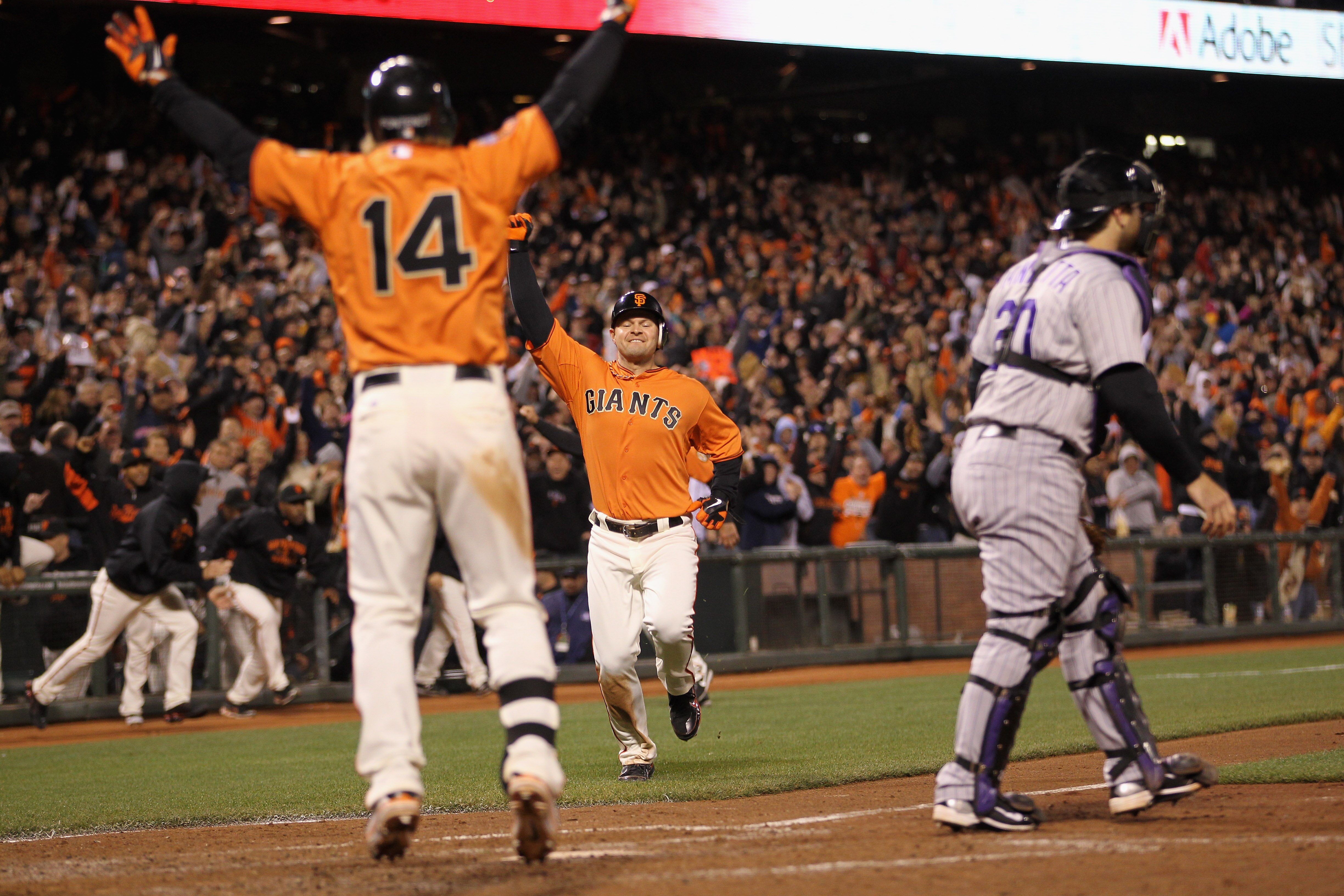SAN FRANCISCO, CA - MAY 06:  Cody Ross #13 of the San Francisco Giants runs to home plate to score the winning run on a hit by Freddy Sanchez #21 in the bottom of the ninth inning against the Colorado Rockies at AT&T Park on May 6, 2011 in San Francisco,
