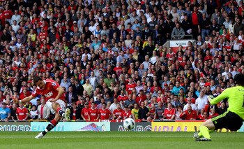 MANCHESTER, ENGLAND - MAY 08: Javier Hernandez of Manchester United scores the opening goal during the Barclays Premier League match between Manchester United and Chelsea at Old Trafford on May 8, 2011 in Manchester, England.  (Photo by Alex Livesey/Getty