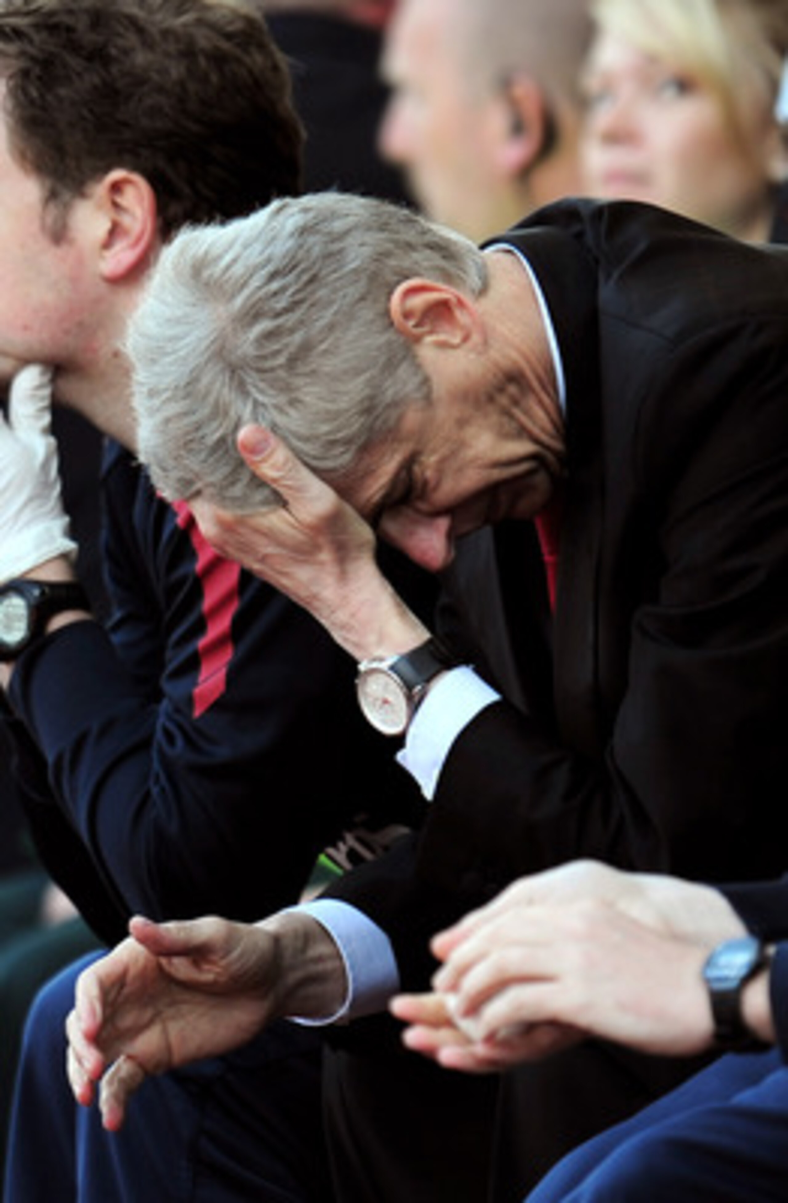 STOKE ON TRENT, ENGLAND - MAY 08:  A dejected Arsene Wenger the Arsenal manager holds his head in his hands as his team head towards a 3-1 defeat during the Barclays Premier League match between Stoke City and Arsenal at the Britannia Stadium on May 8, 20