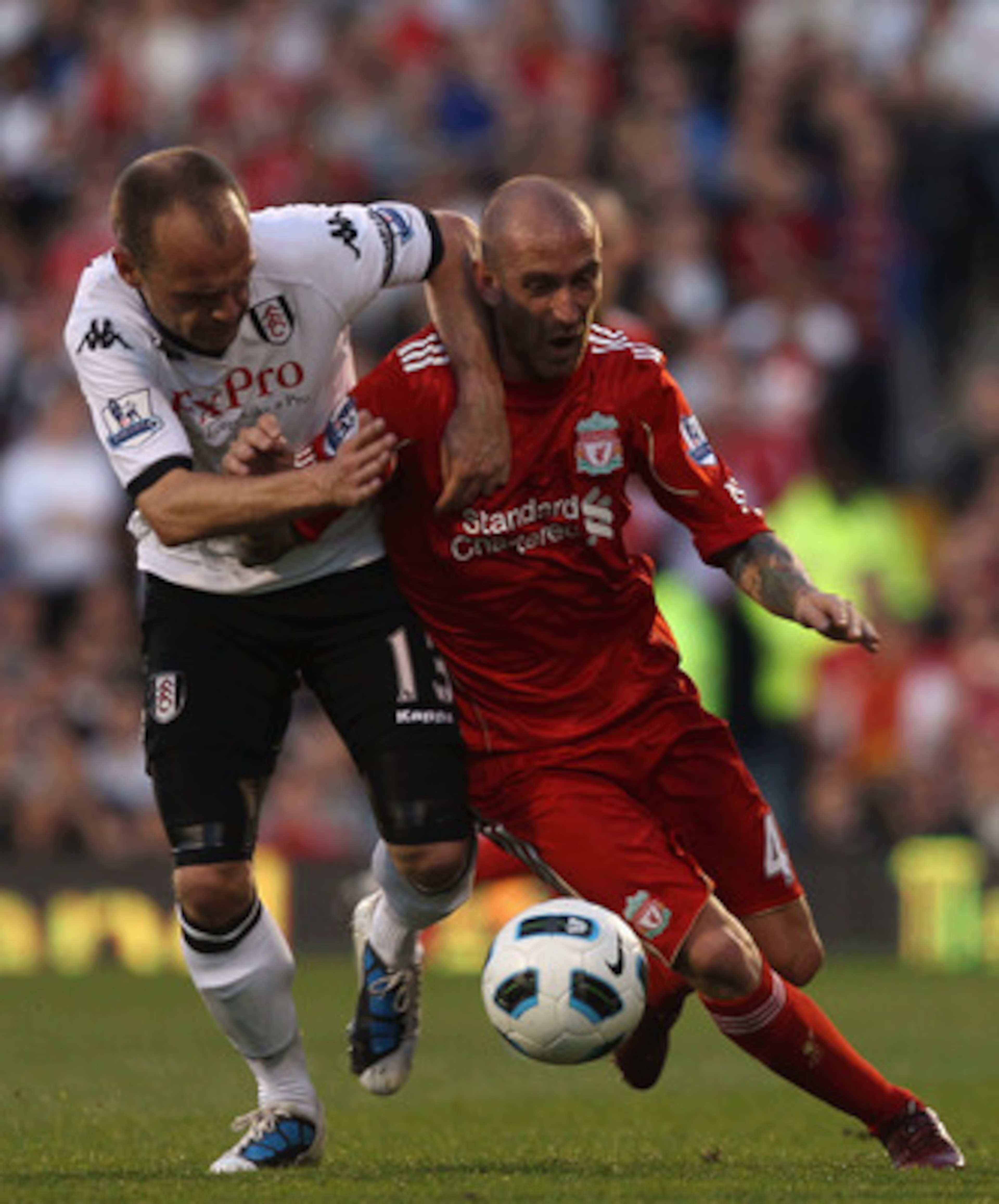 LONDON, ENGLAND - MAY 09:  Danny Murphy of Fulham fights for the ball with Raul Meireles of Liverpool during the Barclays Premier League match between Fulham and Liverpool at Craven Cottage on May 9, 2011 in London, England.  (Photo by Scott Heavey/Getty 