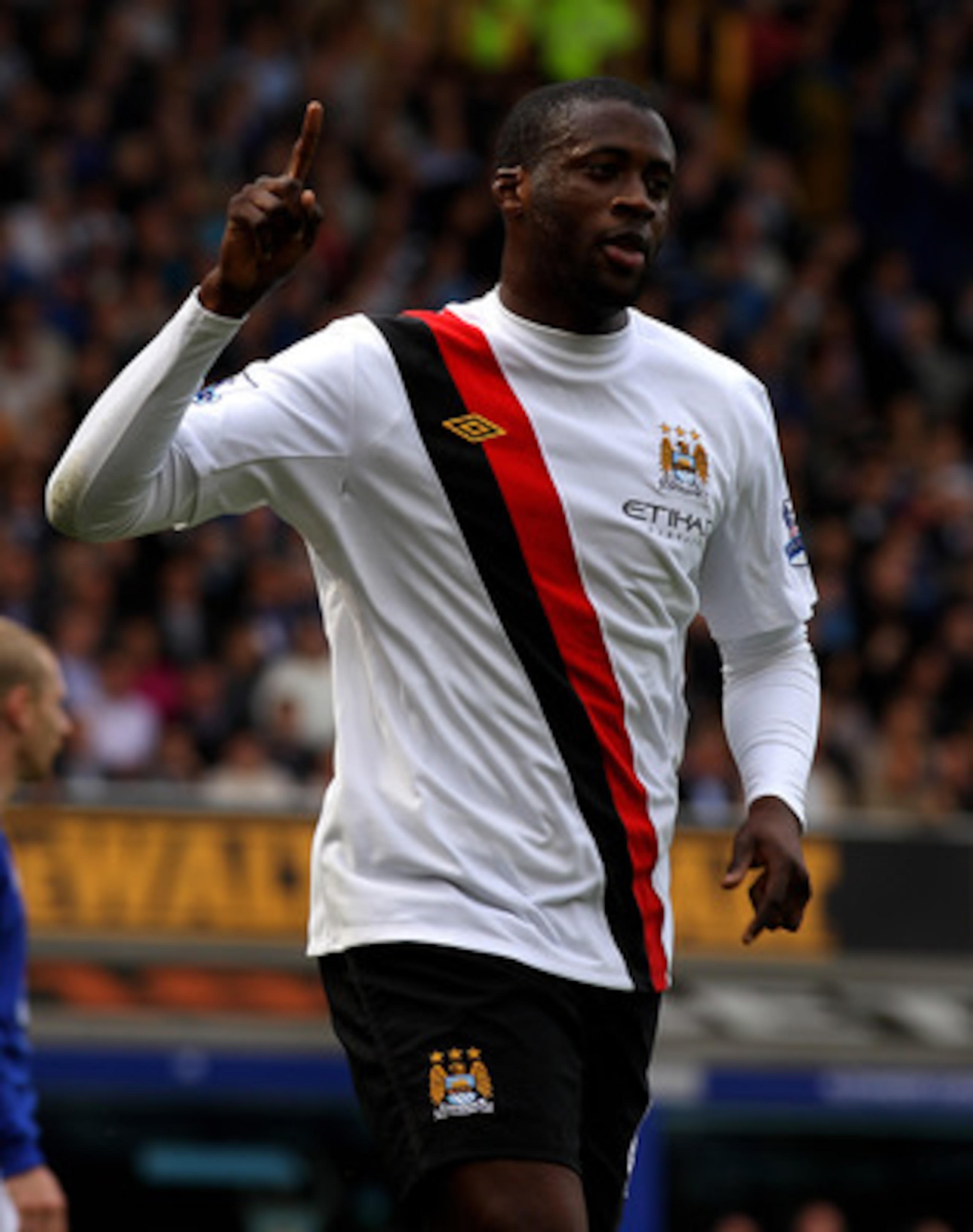 LIVERPOOL, ENGLAND - MAY 07:  Yaya Toure of Manchester City celebrates scoring the opening goal during the Barclays Premier League match between Everton and Manchester City at Goodison Park on May 7, 2011 in Liverpool, England. (Photo by Alex Livesey/Gett