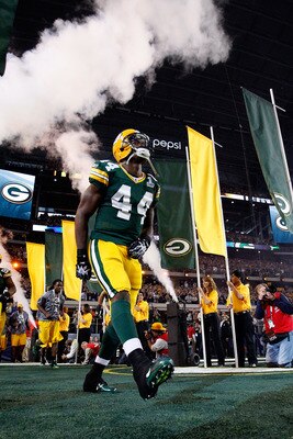 ARLINGTON, TX - FEBRUARY 06:  James Starks #44 of the Green Bay Packers runs onto the field during pregame introductions and festivities against the Pittsburgh Steelers during Super Bowl XLV at Cowboys Stadium on February 6, 2011 in Arlington, Texas.  (Ph