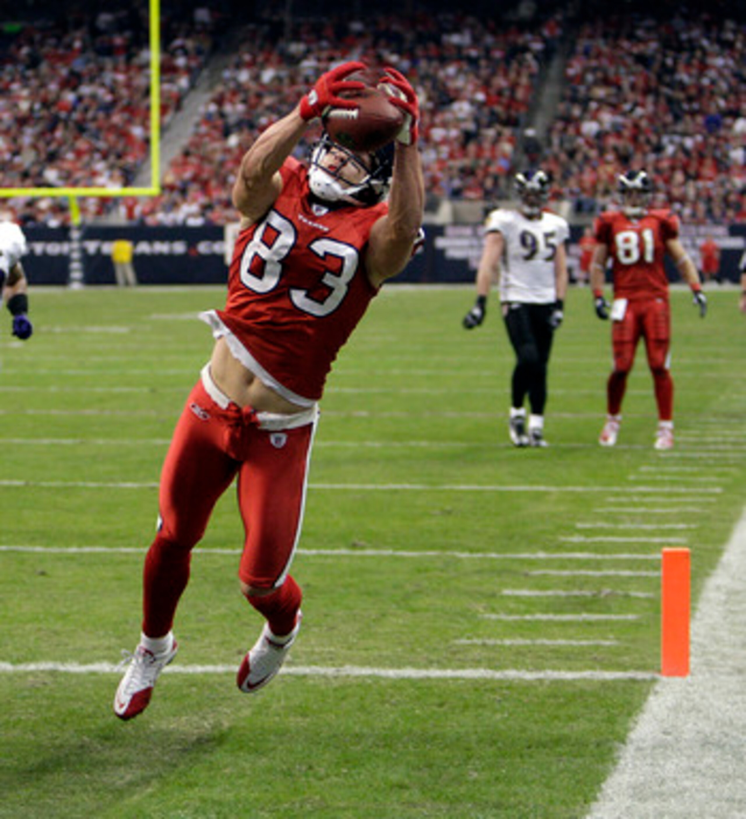 HOUSTON, TX - DECEMBER 13:  Wide receiver  Kevin Walter #83 of the Houston Texans completes a pass in the rear of the endzone but was ruled out of bounds on instant replay during action against the Baltimore Ravens at Reliant Stadium on December 13, 2010