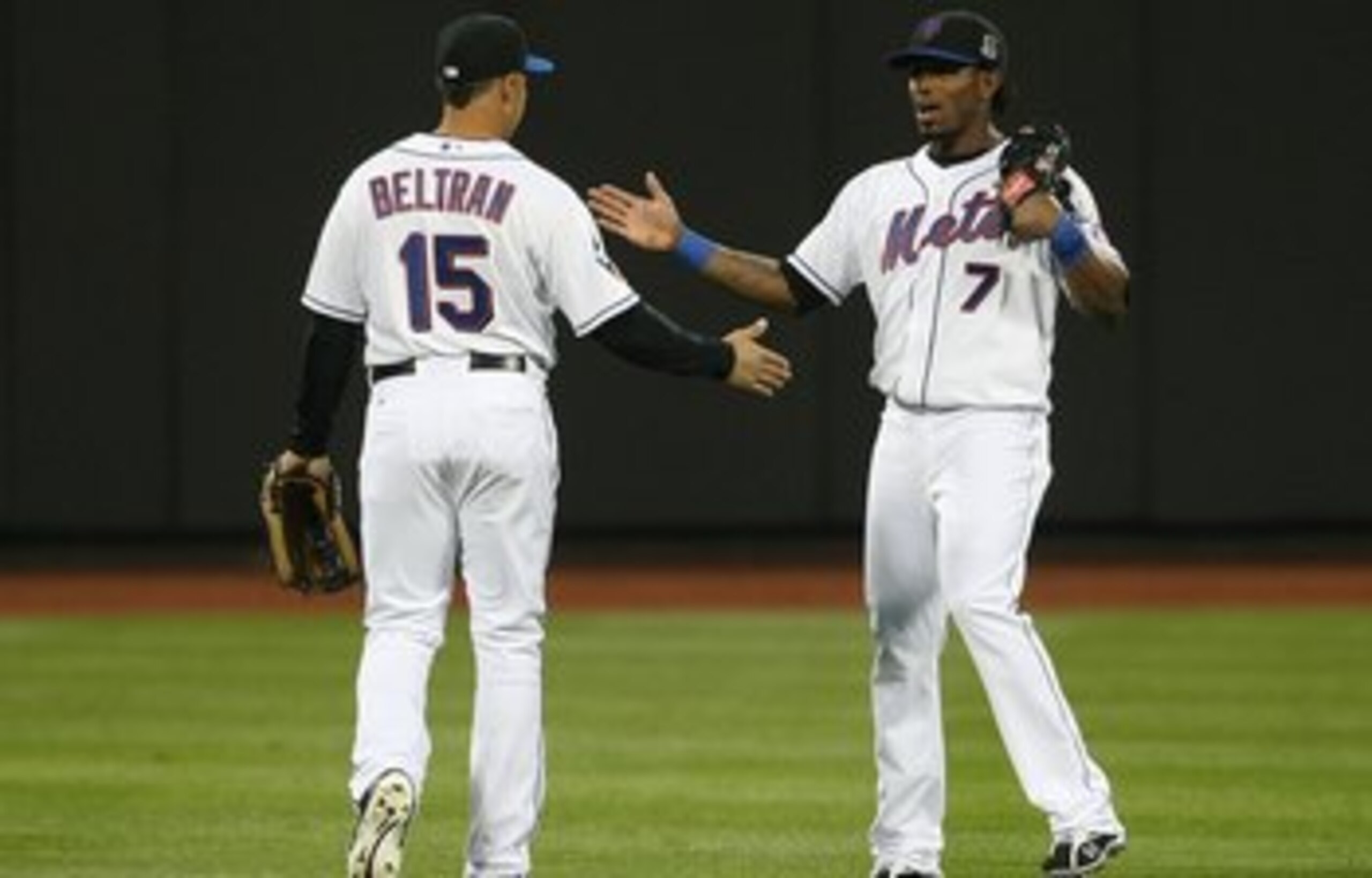 FLUSHING, NY - APRIL 13:  Jose Reyes #7 of the New York Mets and teammate Carlos Beltran #15  in the field  against the San Diego Padres during opening day at Citi Field on April 13, 2009 in the Flushing neighborhood of the Queens borough of New York City