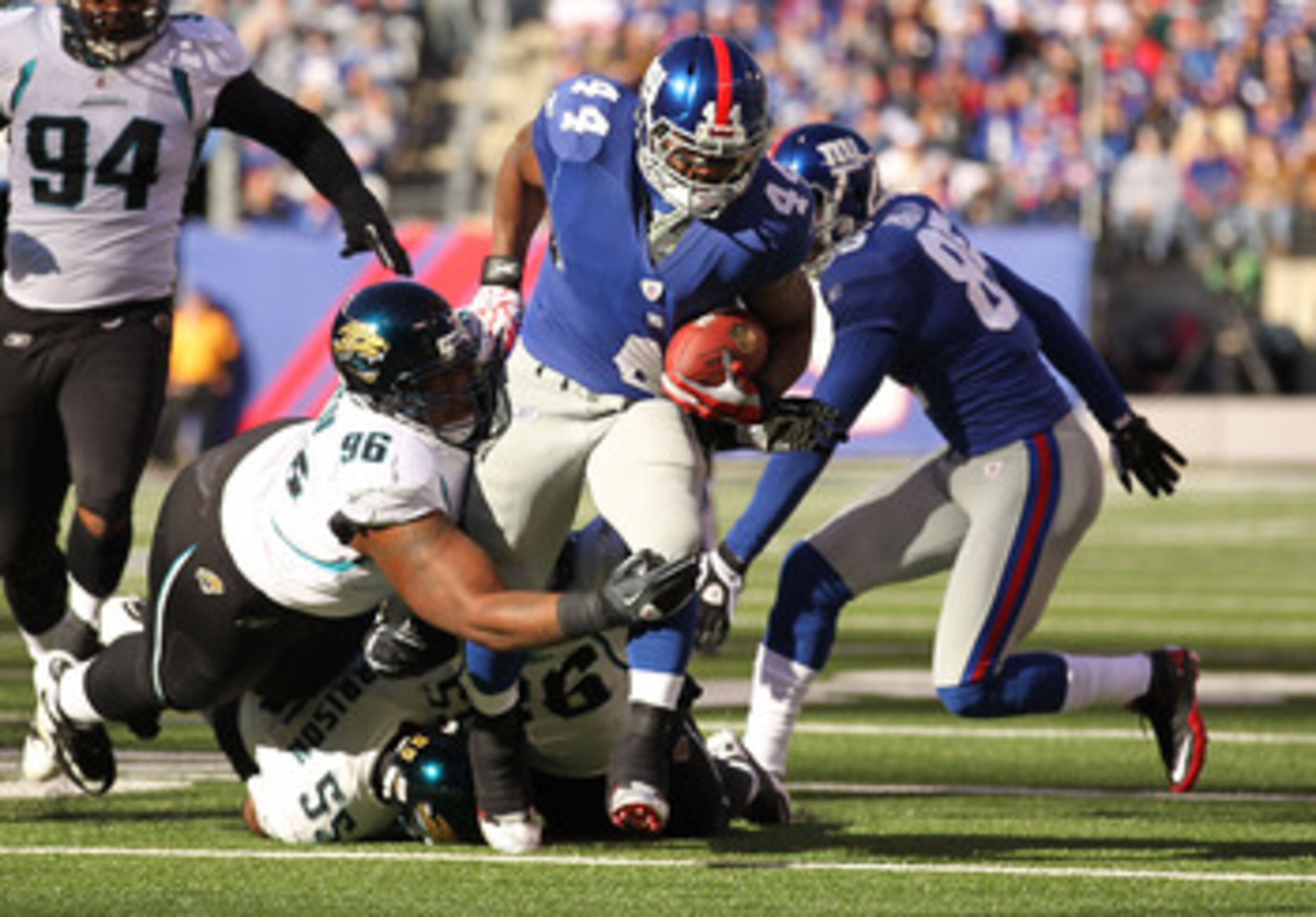 EAST RUTHERFORD, NJ - NOVEMBER 28:  Ahmad Bradshaw #44 of the New York Giants runs with the ball as Terrance Knighton #96 of the Jacksonville Jaguars attempts the tackle during their game on November 28, 2010 at The New Meadowlands Stadium in East Rutherf