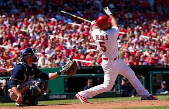 ST. LOUIS, MO - MAY 8: Albert Pujols #5 of the St. Louis Cardinals hits a double against the Milwaukee Brewers at Busch Stadium on May 8, 2011 in St. Louis, Missouri.  (Photo by Dilip Vishwanat/Getty Images)