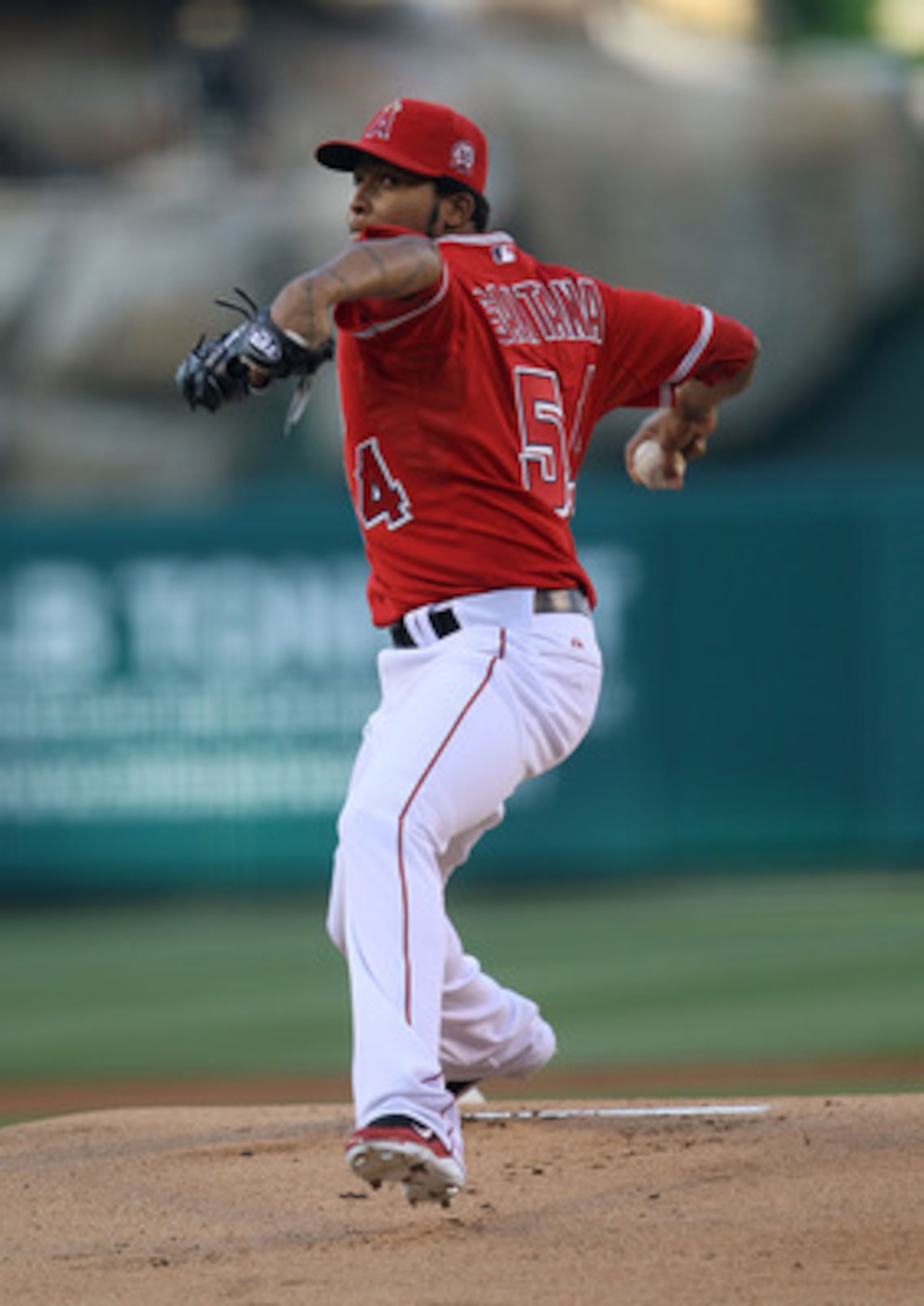 ANAHEIM, CA - APRIL 23:  Ervin Santana #54 of the Los Angeles Angels of Anaheim throws a pitch against the Boston Red Sox on April 23, 2011 at Angel Stadium in Anaheim, California.  (Photo by Stephen Dunn/Getty Images)